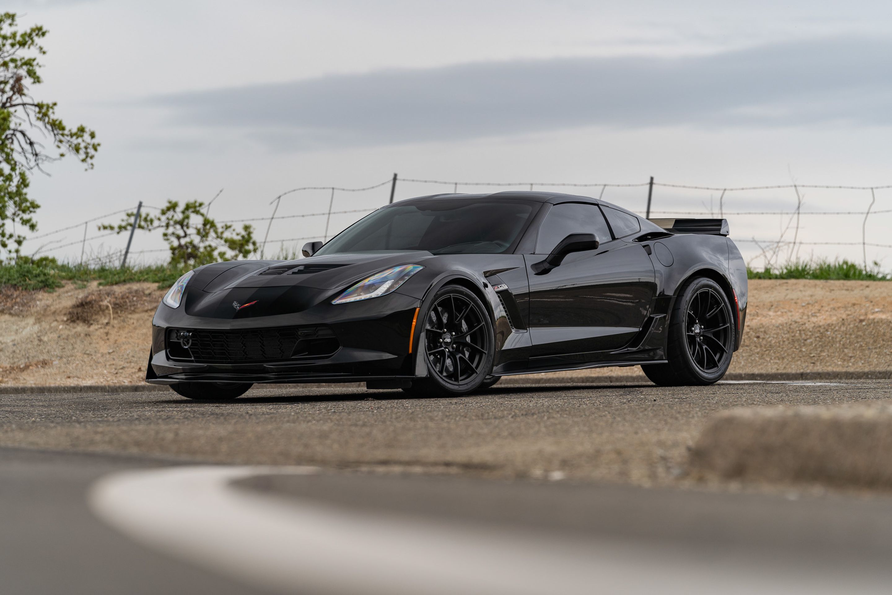 Black Chevrolet C7 Corvette Z06 with 19" VS-5RS Apex wheels in Satin Black