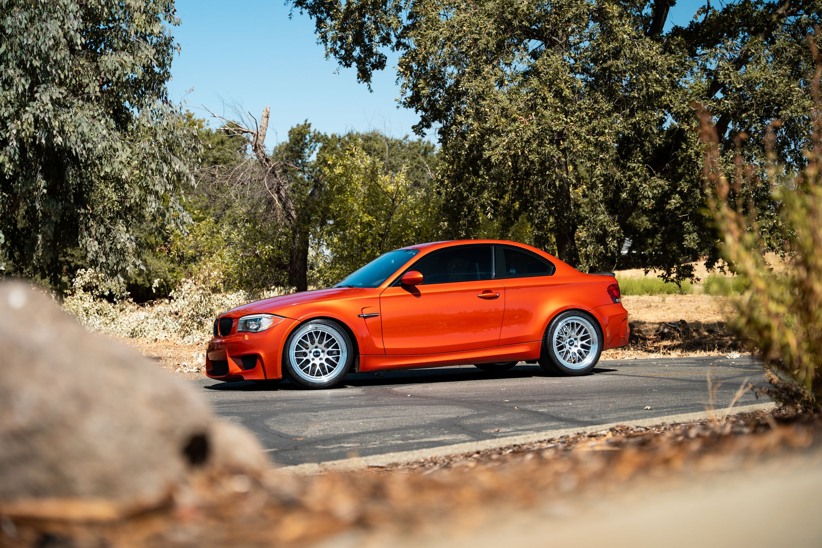 Orange BMW E82 1M with 19" ML-10RT Apex wheels in Machined Lip Race Silver
