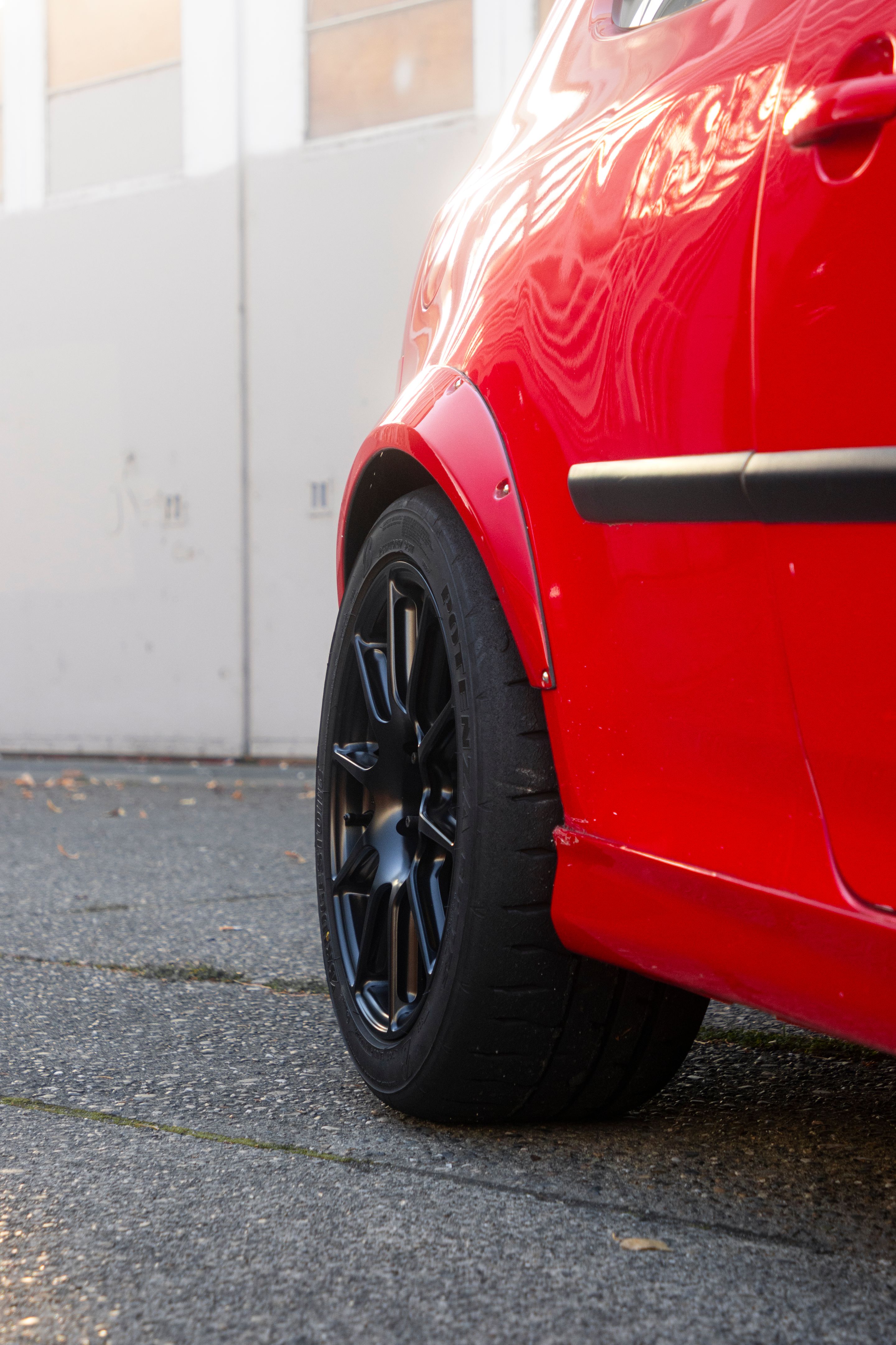 Red VW MK5 Golf with 17" SM-10 Apex wheels in Satin Black