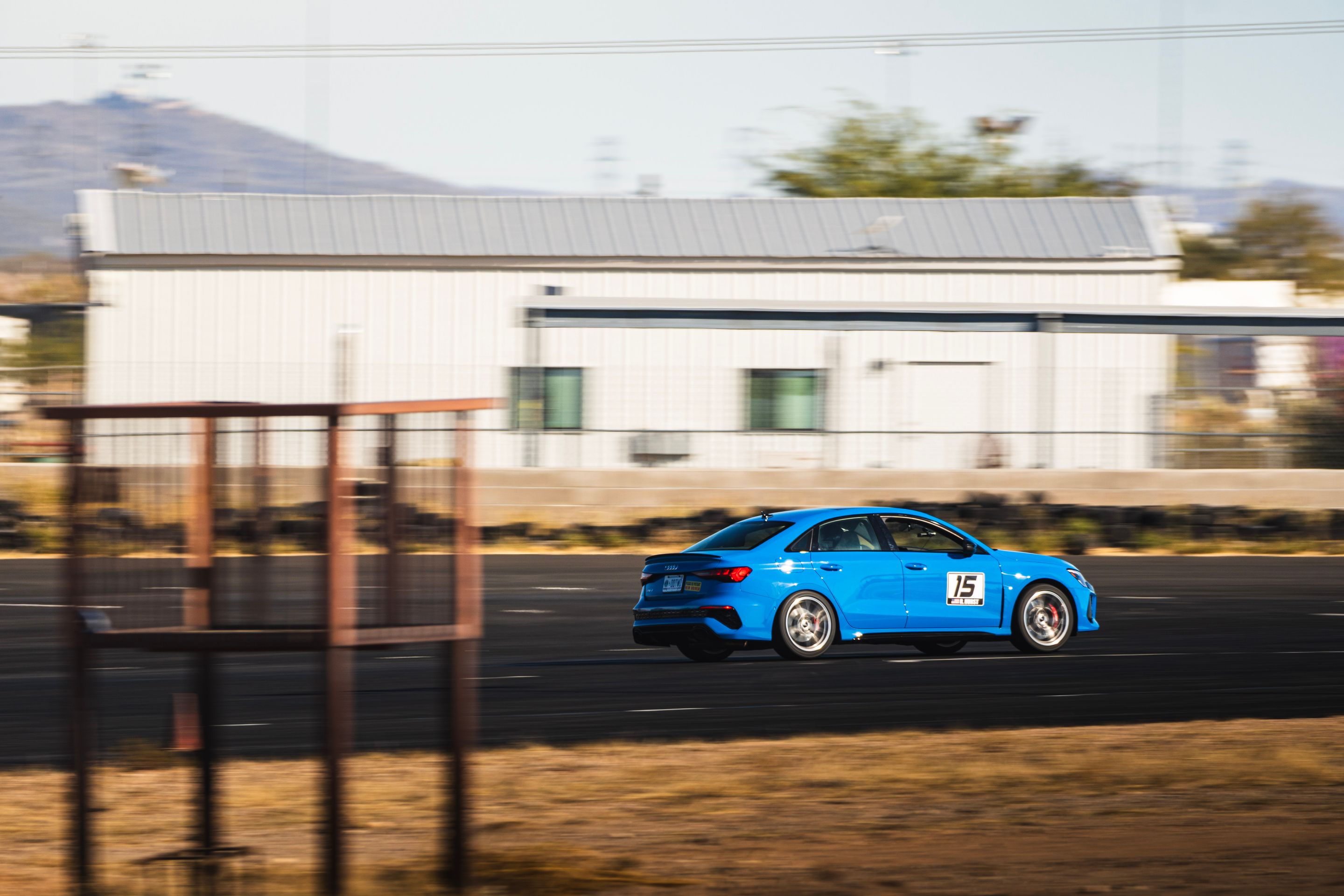 Blue Audi 8Y RS 3 with 18" VS-5RS Apex wheels in Brushed Clear