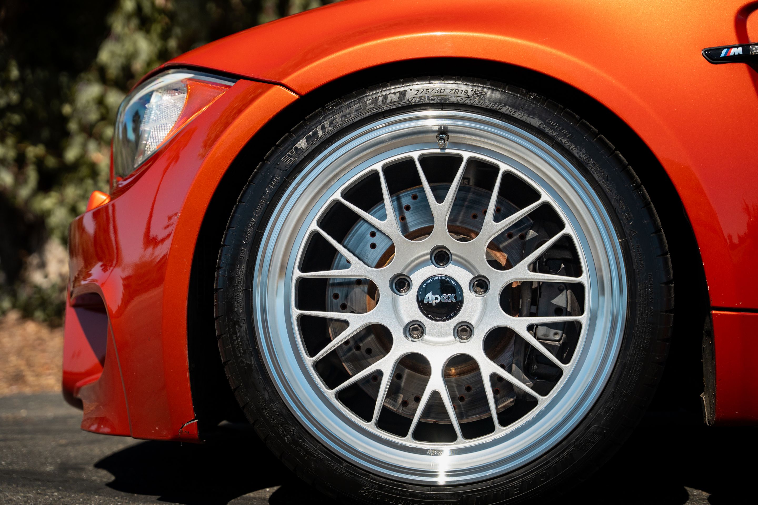 Orange BMW E82 1M with 19" ML-10RT Apex wheels in Machined Lip Race Silver