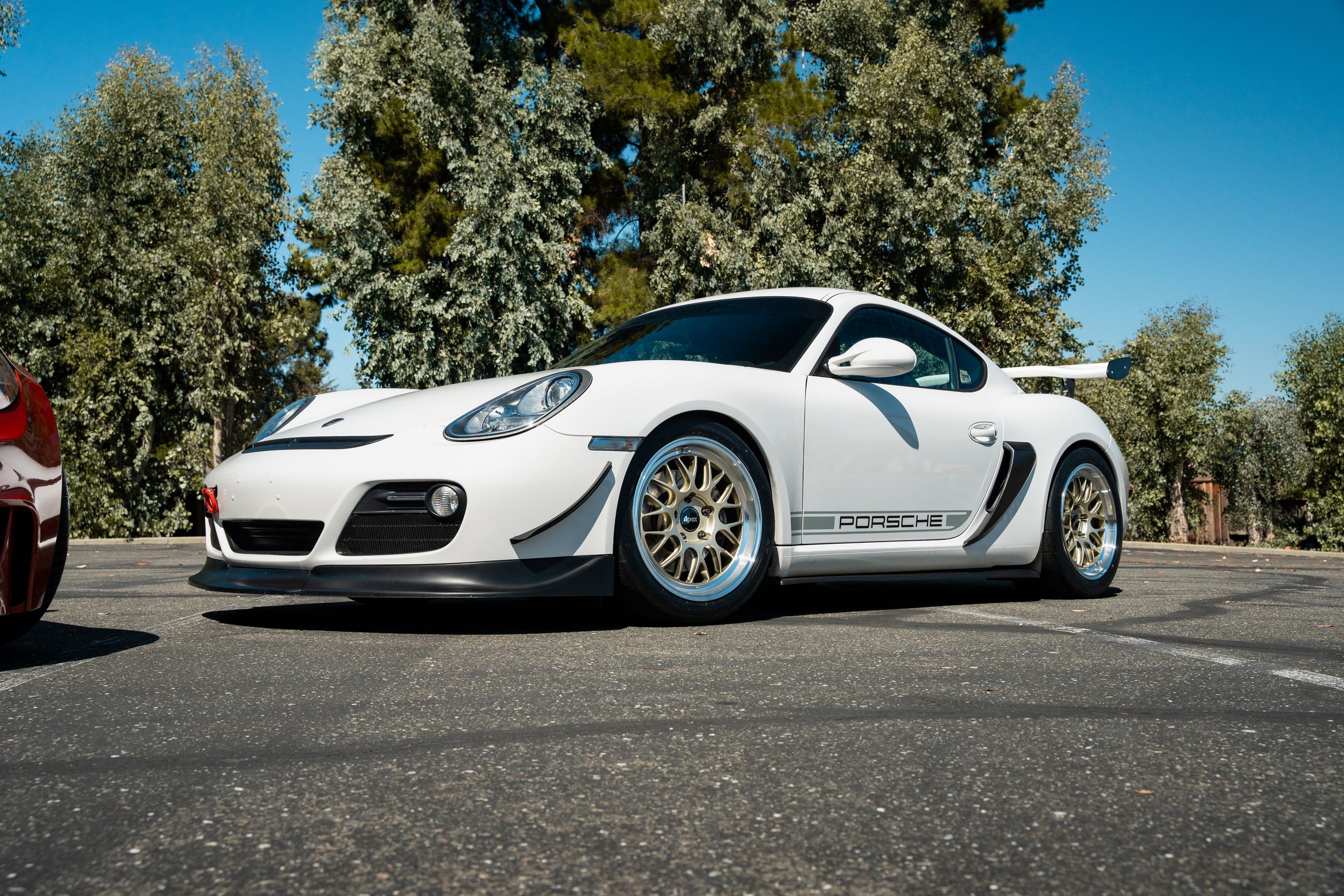 White Porsche 987 Cayman Base with 18" ML-10RT Apex wheels in Machined Lip Gloss Motorsport Gold