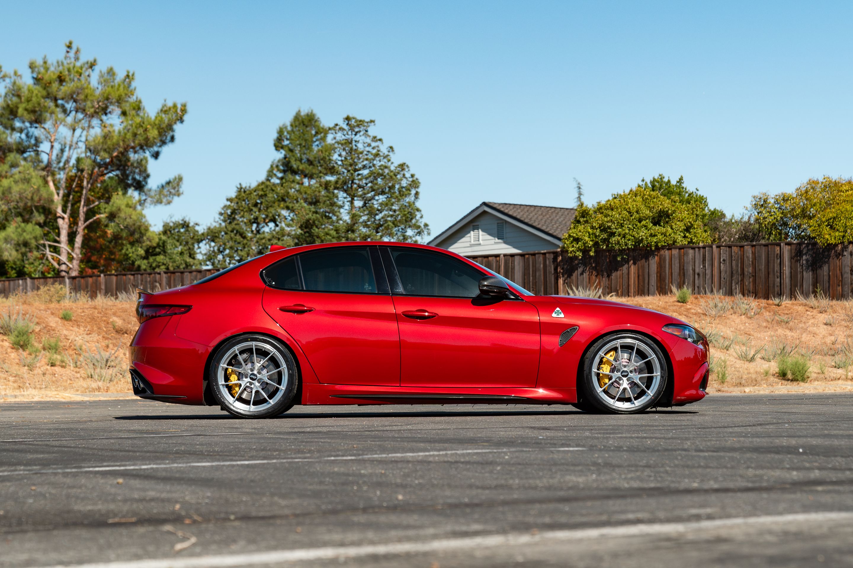 Red Alfa Romeo Giulia Quadrifoglio with 19" VS-5RS Apex wheels in Brushed Clear