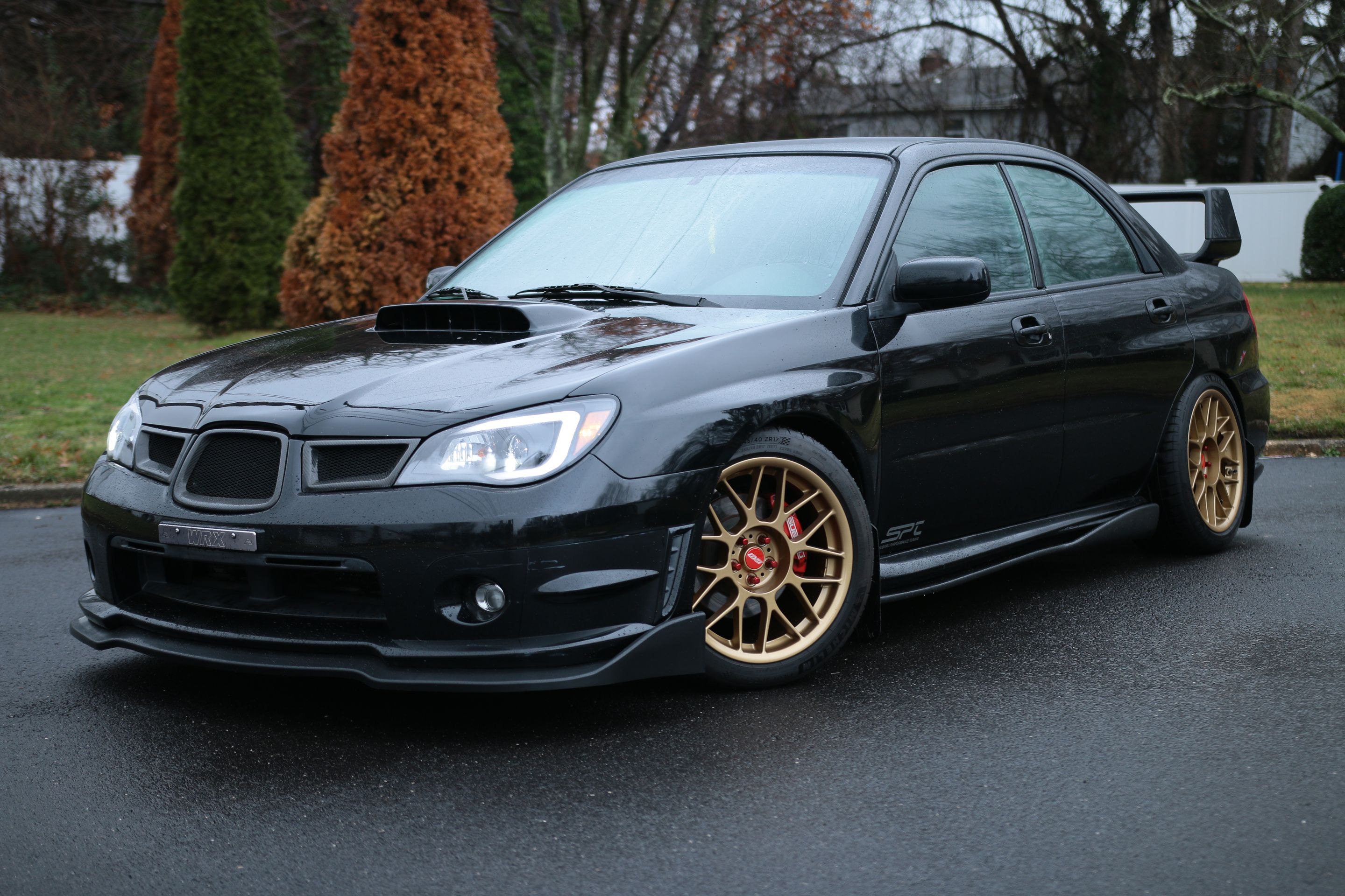 Black Subaru GD WRX Sedan with 17" ARC-8 Apex wheels in Satin Bronze