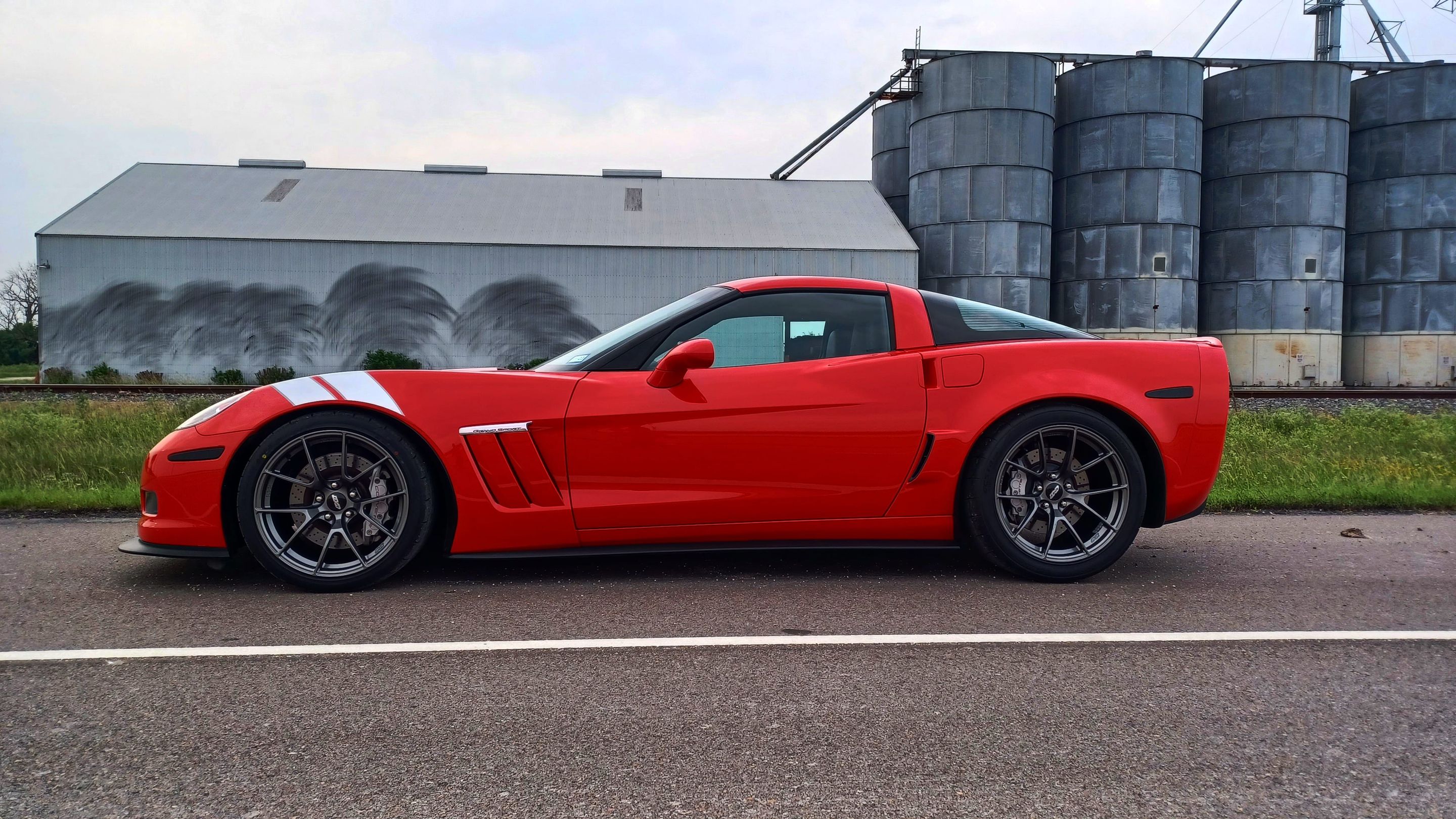 Red Chevrolet C6 Corvette Grand Sport with 19" VS-5RS Apex wheels in Anthracite