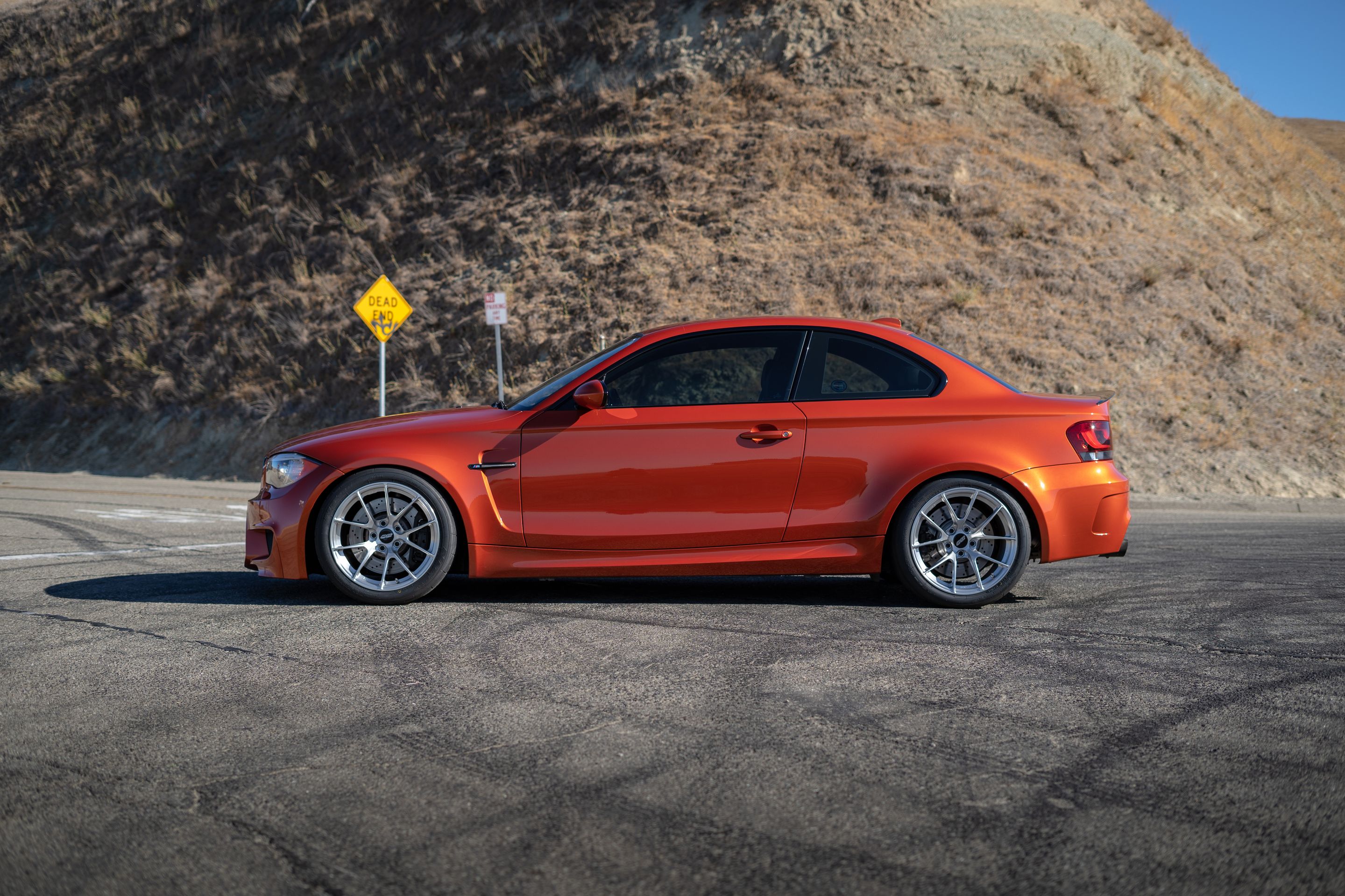 Orange BMW E82 1M with 18" VS-5RS Apex wheels in Brushed Clear