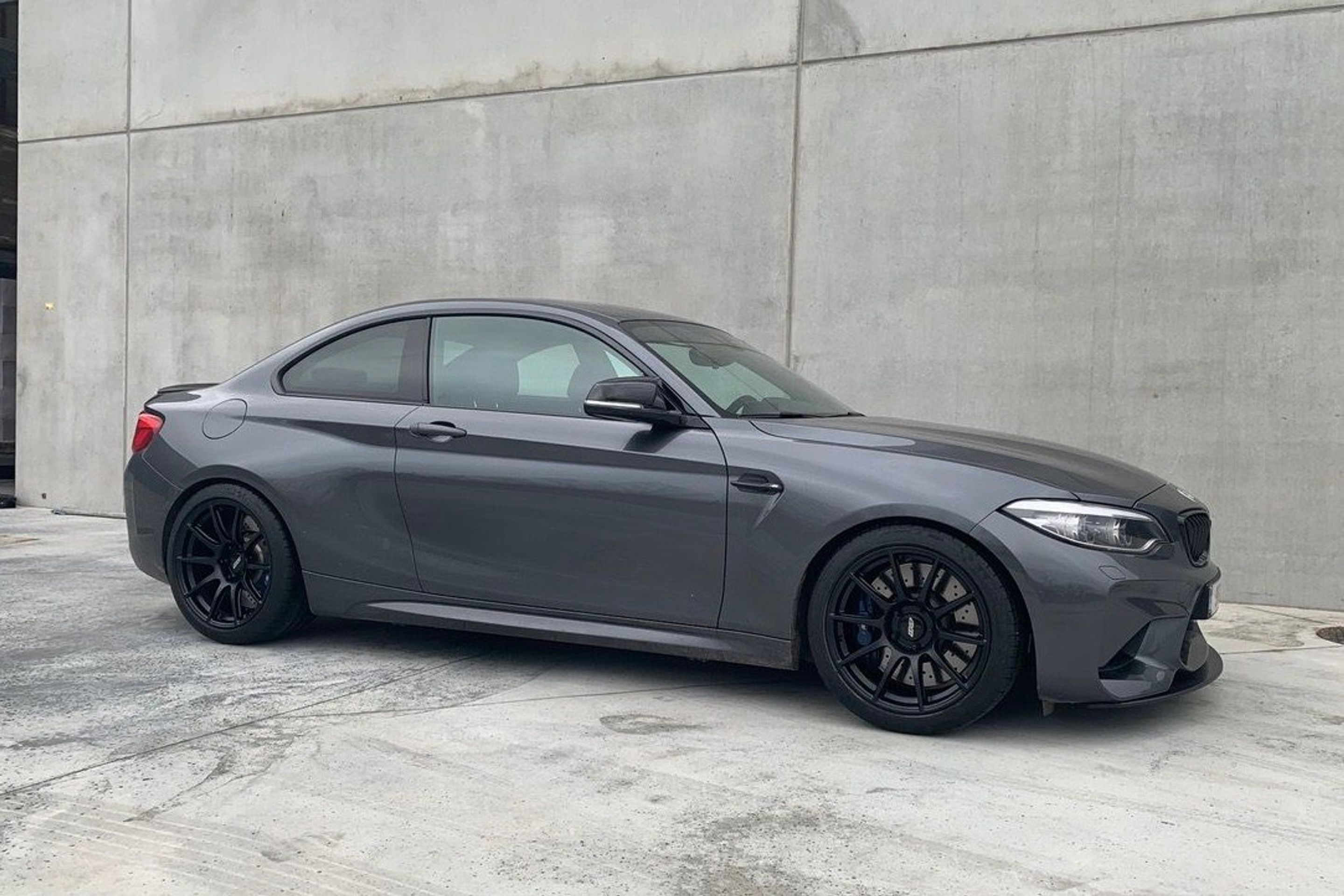 Grey BMW F87 M2 with 18" SM-10 Apex wheels in Satin Black