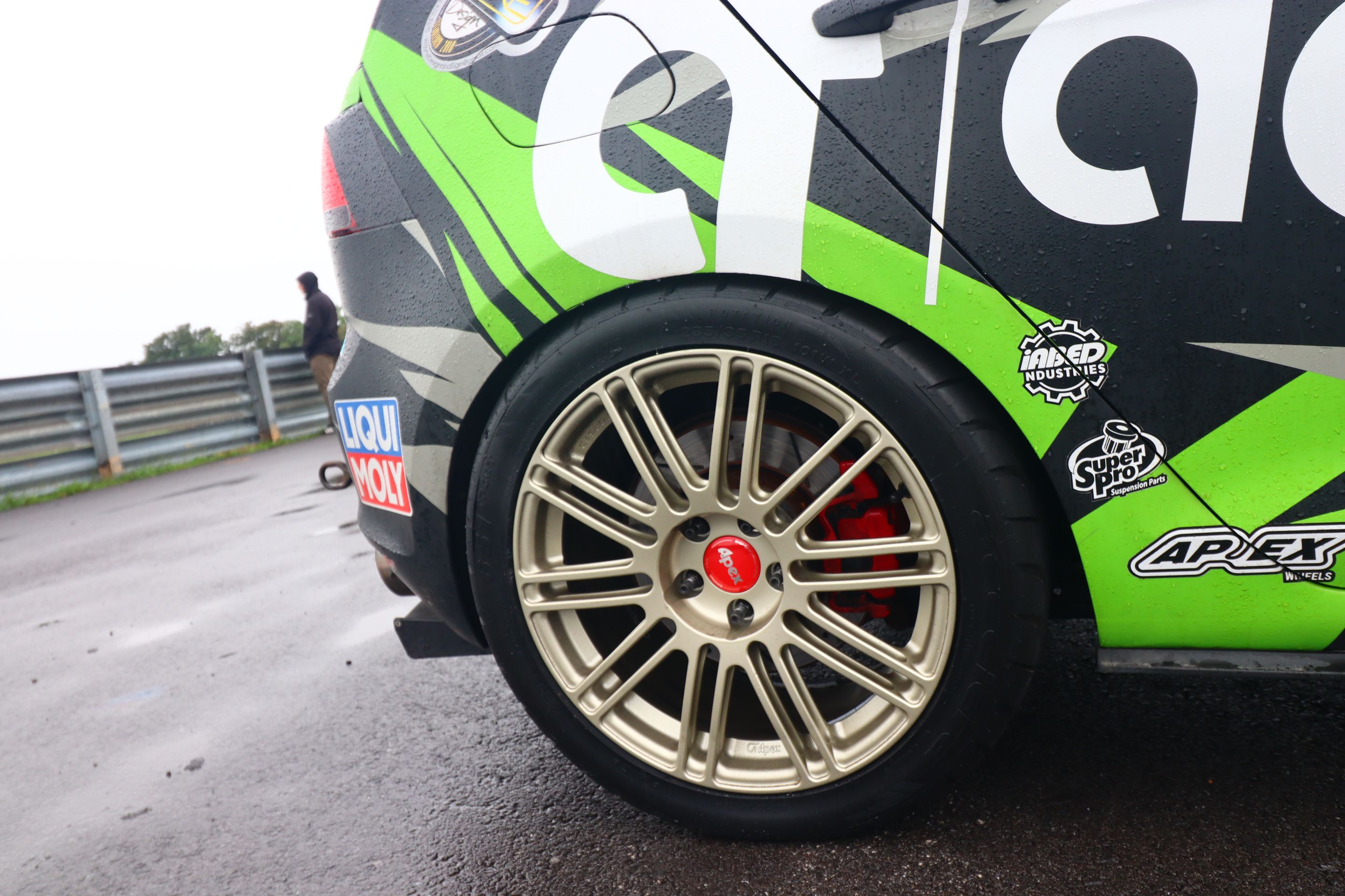 Race Livery VW MK7 GTI with 18" TC-10RT Apex wheels in Motorsport Gold