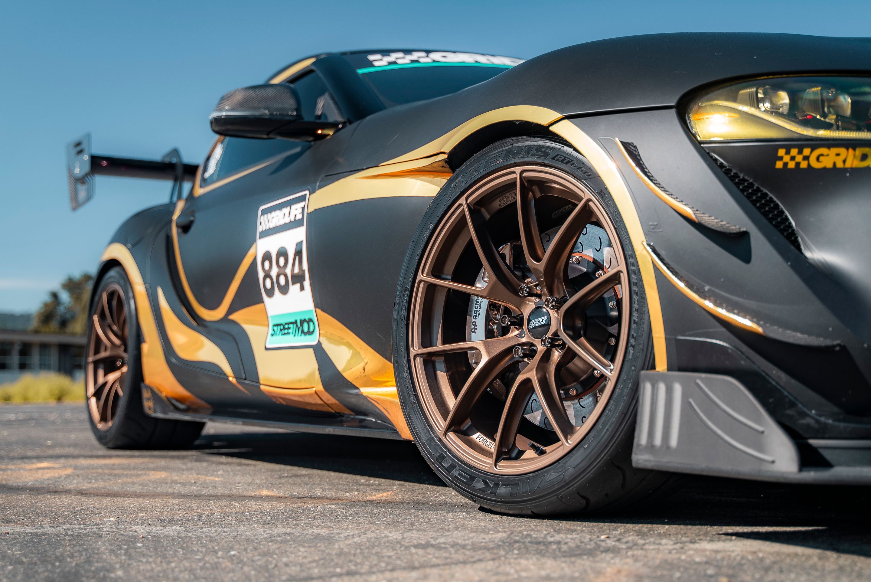 Grey Toyota GR Supra with 19" VS-5RS Apex wheels in Satin Bronze