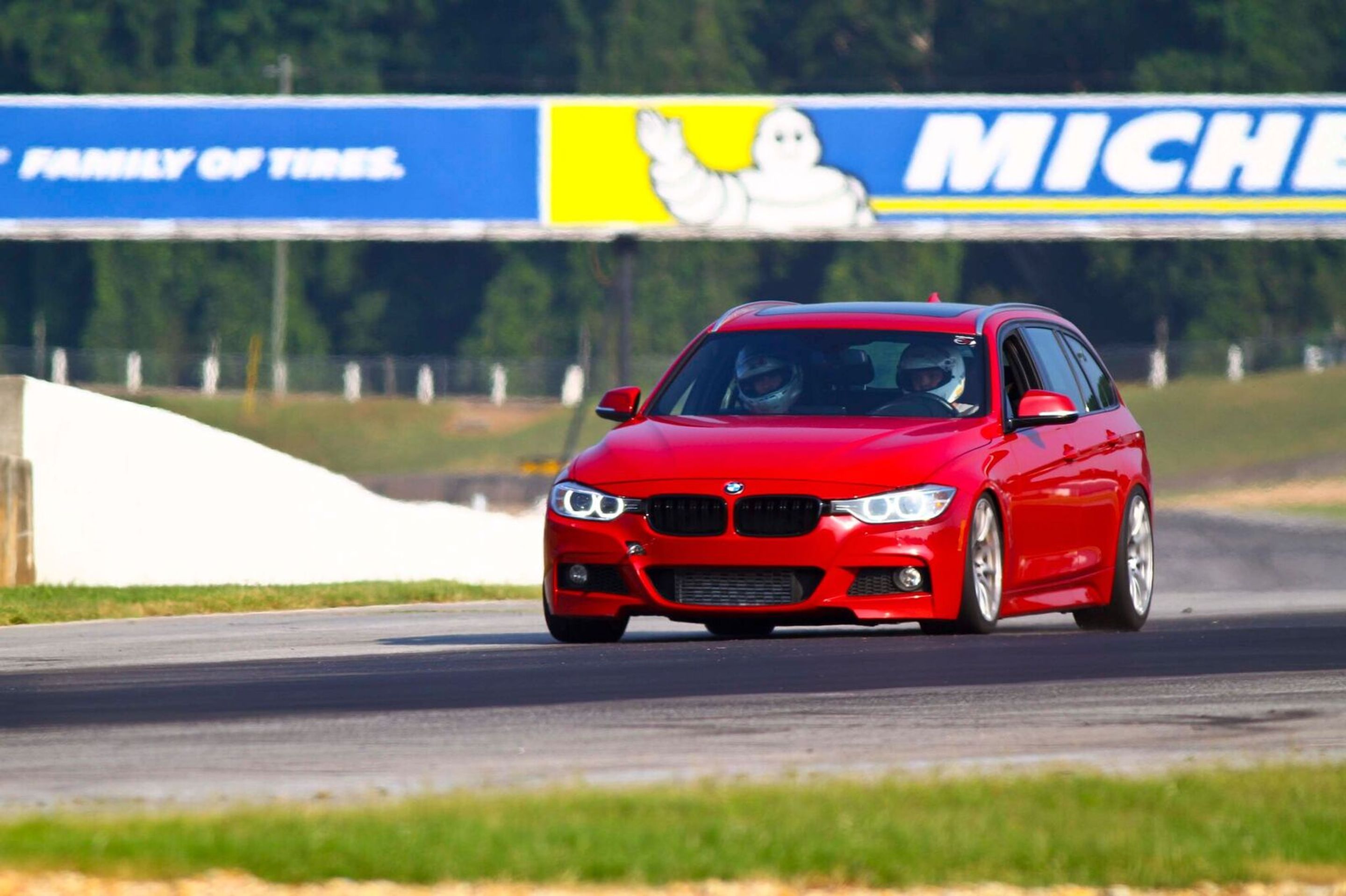 Red BMW F31 Wagon 3 Series with 18" SM-10 Apex wheels in Race Silver