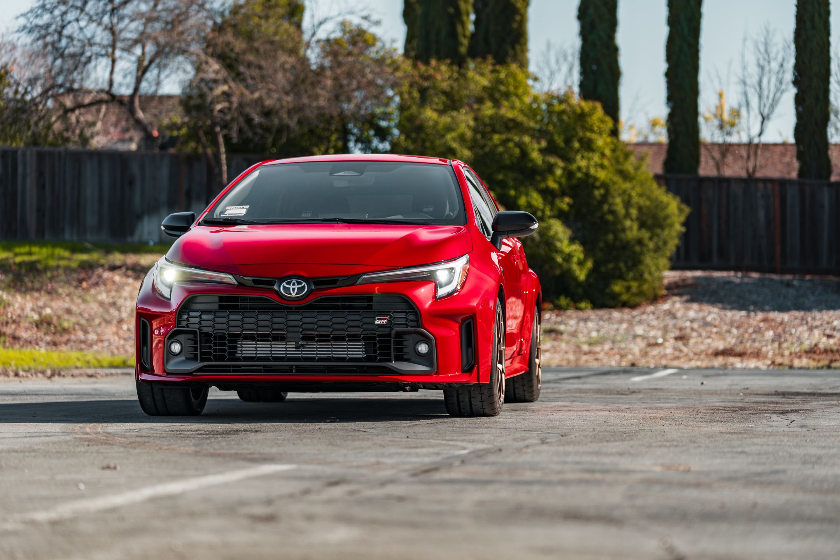 Red Toyota GR Corolla with 17" VS-5RS Apex wheels in Satin Bronze