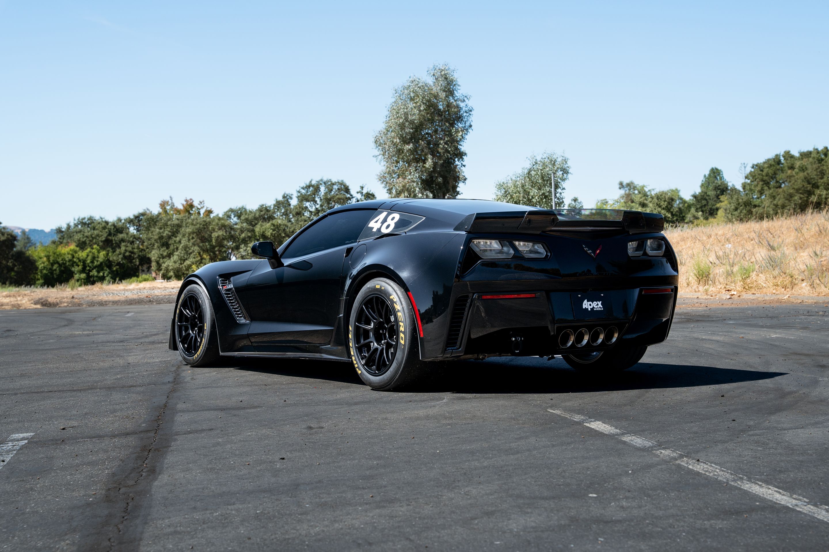 Black Chevrolet C7 Corvette Z06 with 18" SM-10RE Apex wheels in Satin Black
