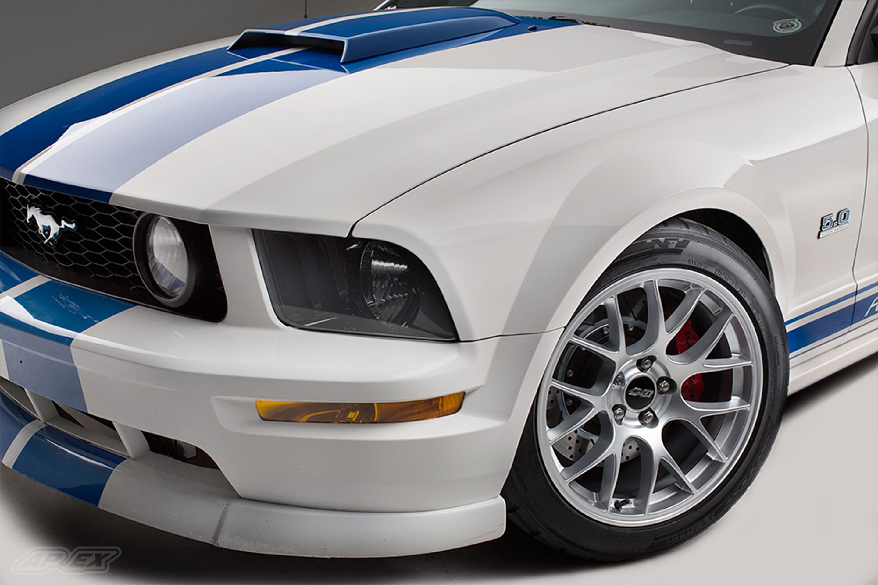 White Ford S197 Mustang GT with 18" EC-7 Apex wheels in Race Silver