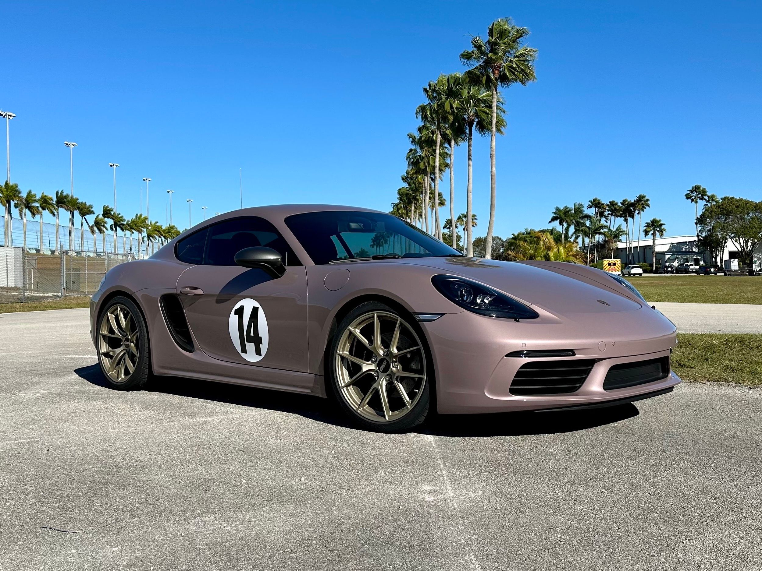 Pink Porsche 718 Cayman T with 20" VS-5RS Apex wheels in Motorsport Gold