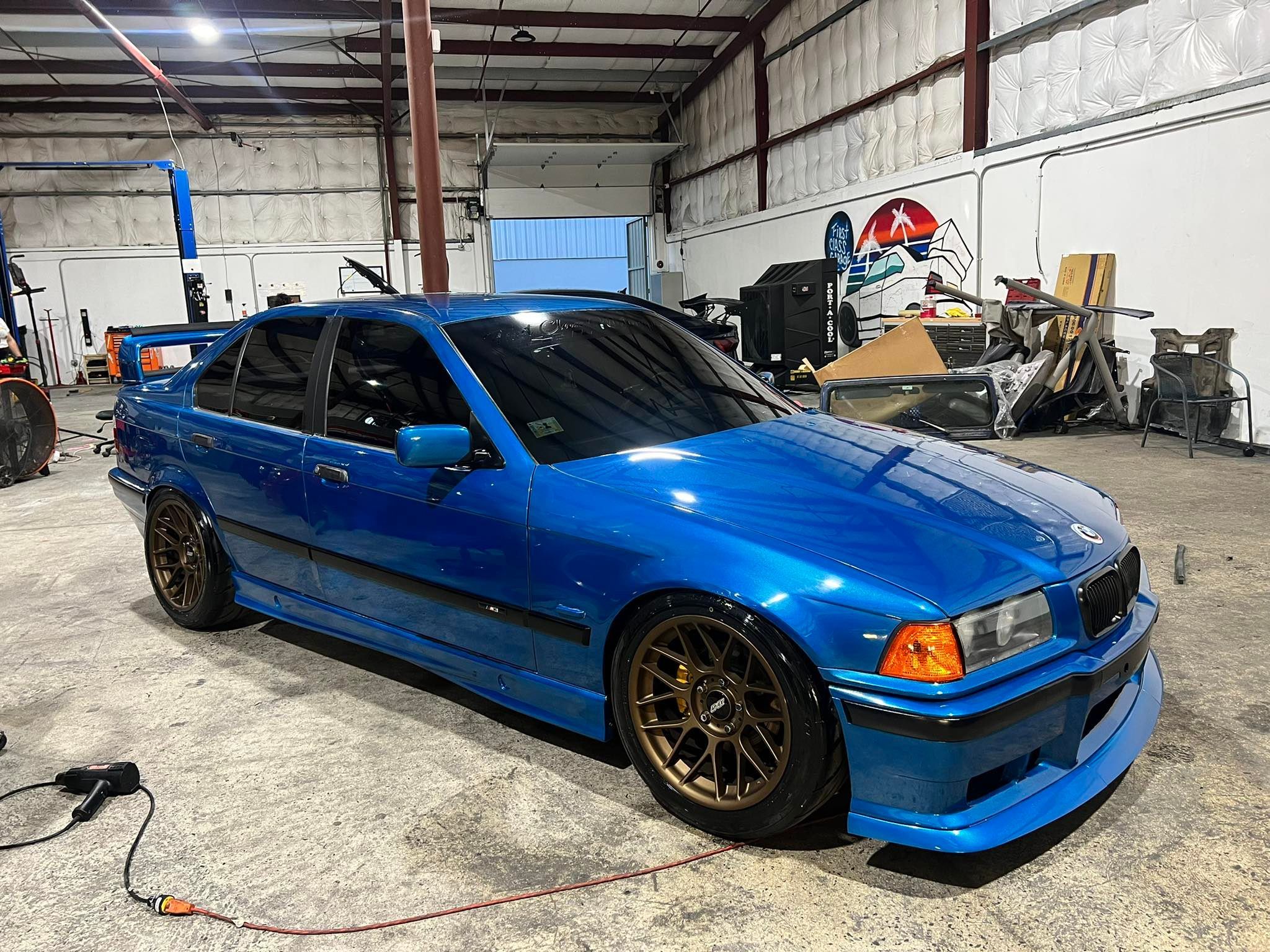 Blue BMW E36 M3 with 17" ARC-8 Apex wheels in Satin Bronze