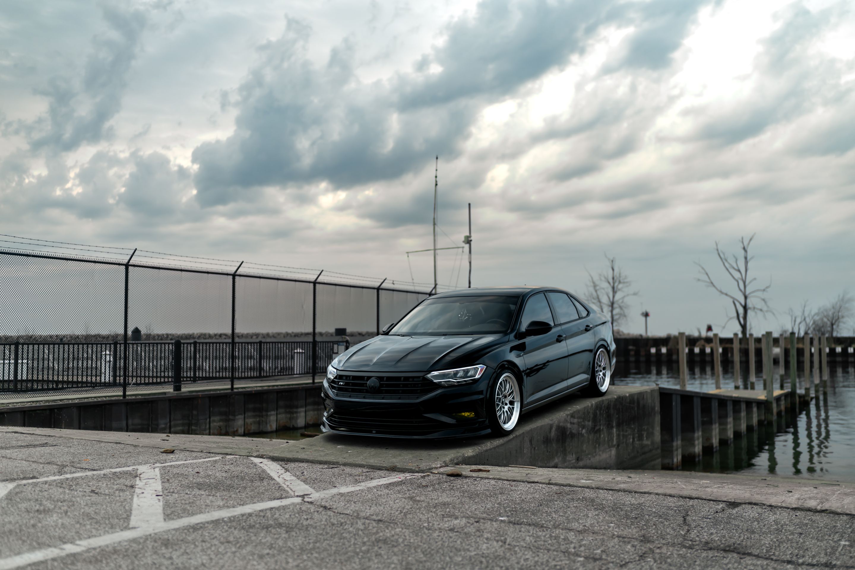 Black VW MK7 Jetta with 19" ML-10RT Apex wheels in Machined Lip Race Silver