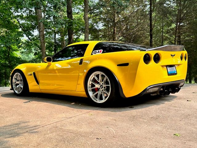 Yellow Chevrolet C6 Corvette Z06 with 18"/19" VS-5RS Apex wheels in Brushed Clear