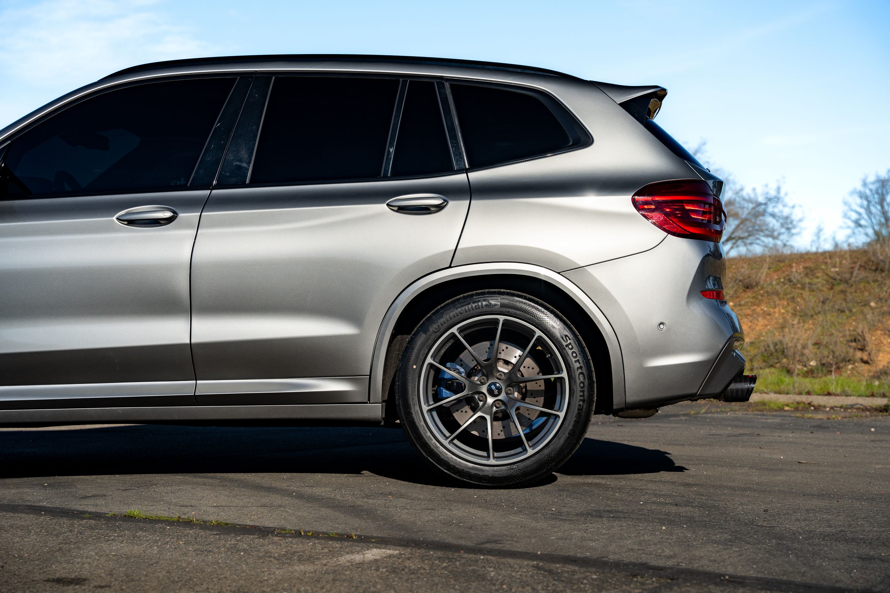 Silver BMW F97 X3M with 20" VS-5RX Apex wheels in Anthracite