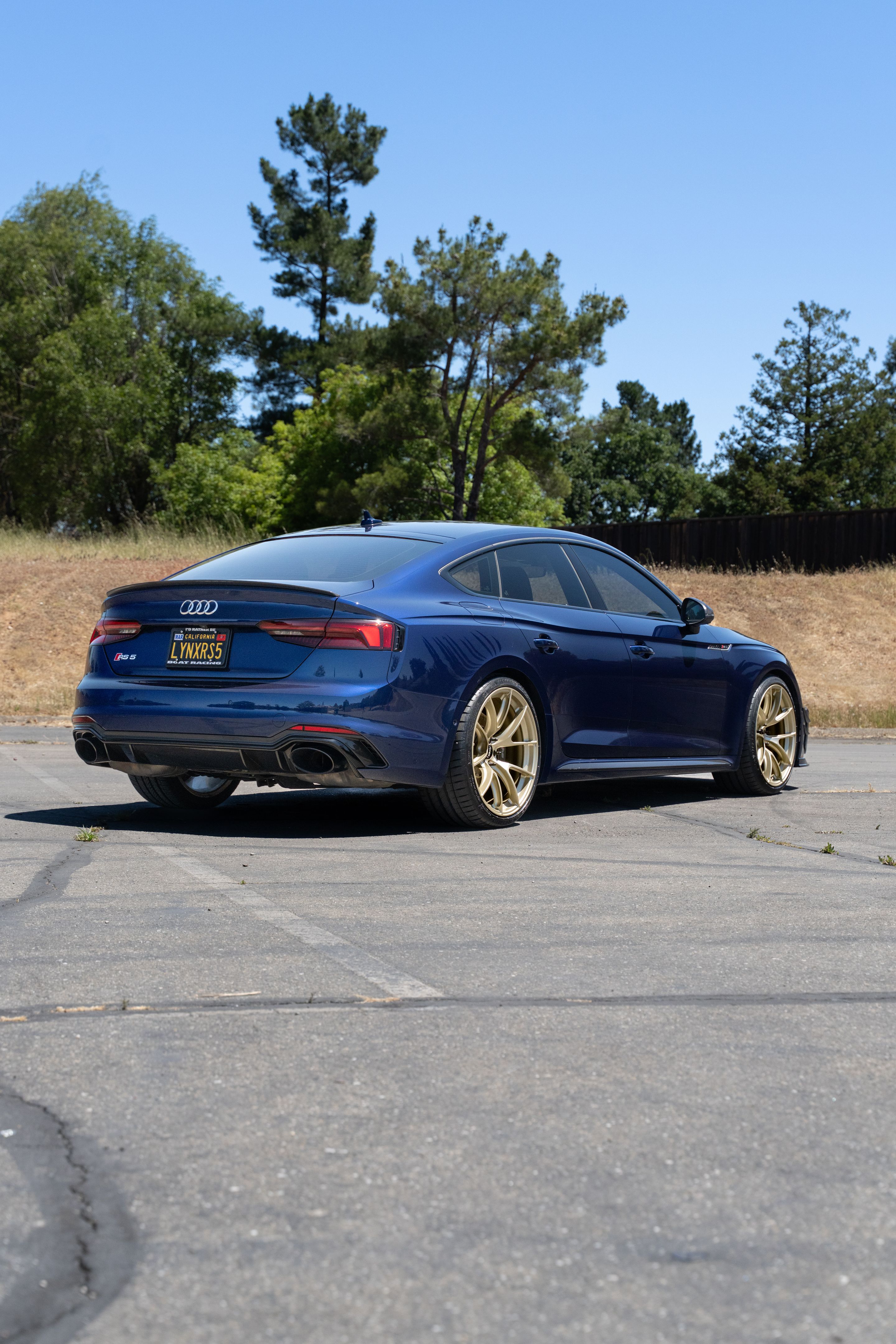 Blue Audi B9 RS 5 Sportback with 20" VS-5RS Apex wheels in Motorsport Gold
