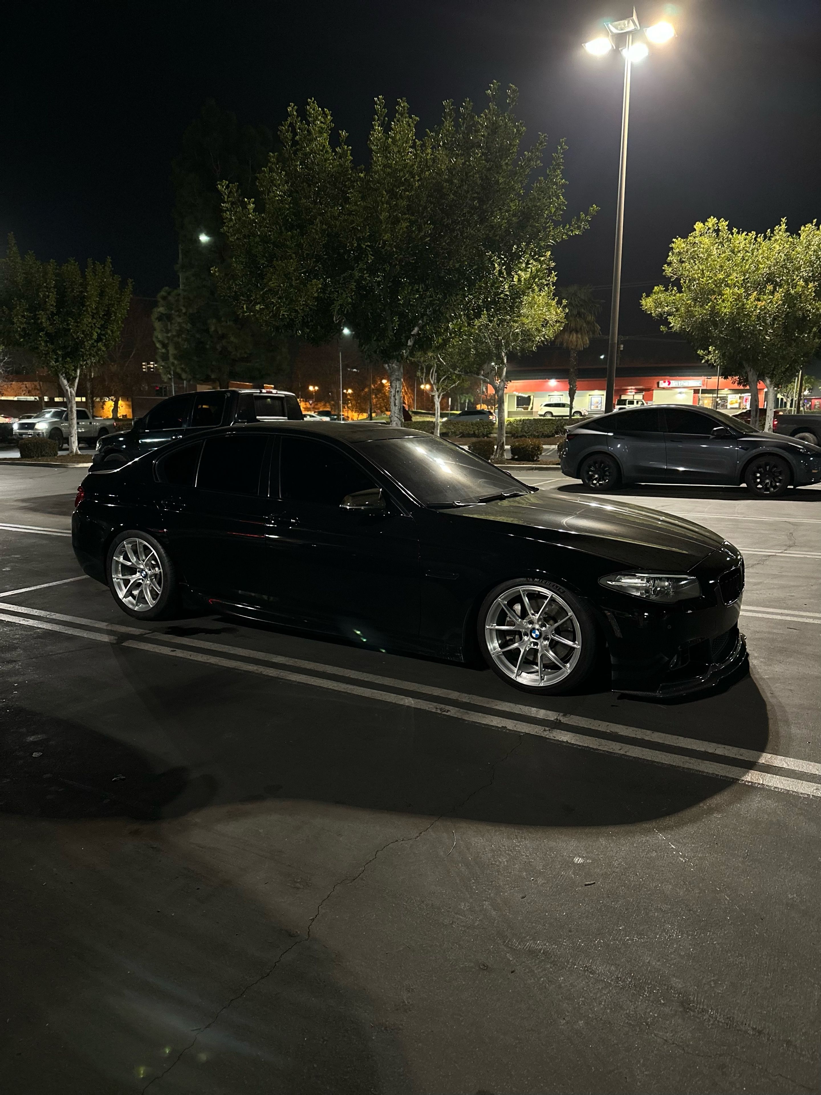 Black BMW F10 Sedan 5 Series with 19" VS-5RS Apex wheels in Brushed Clear