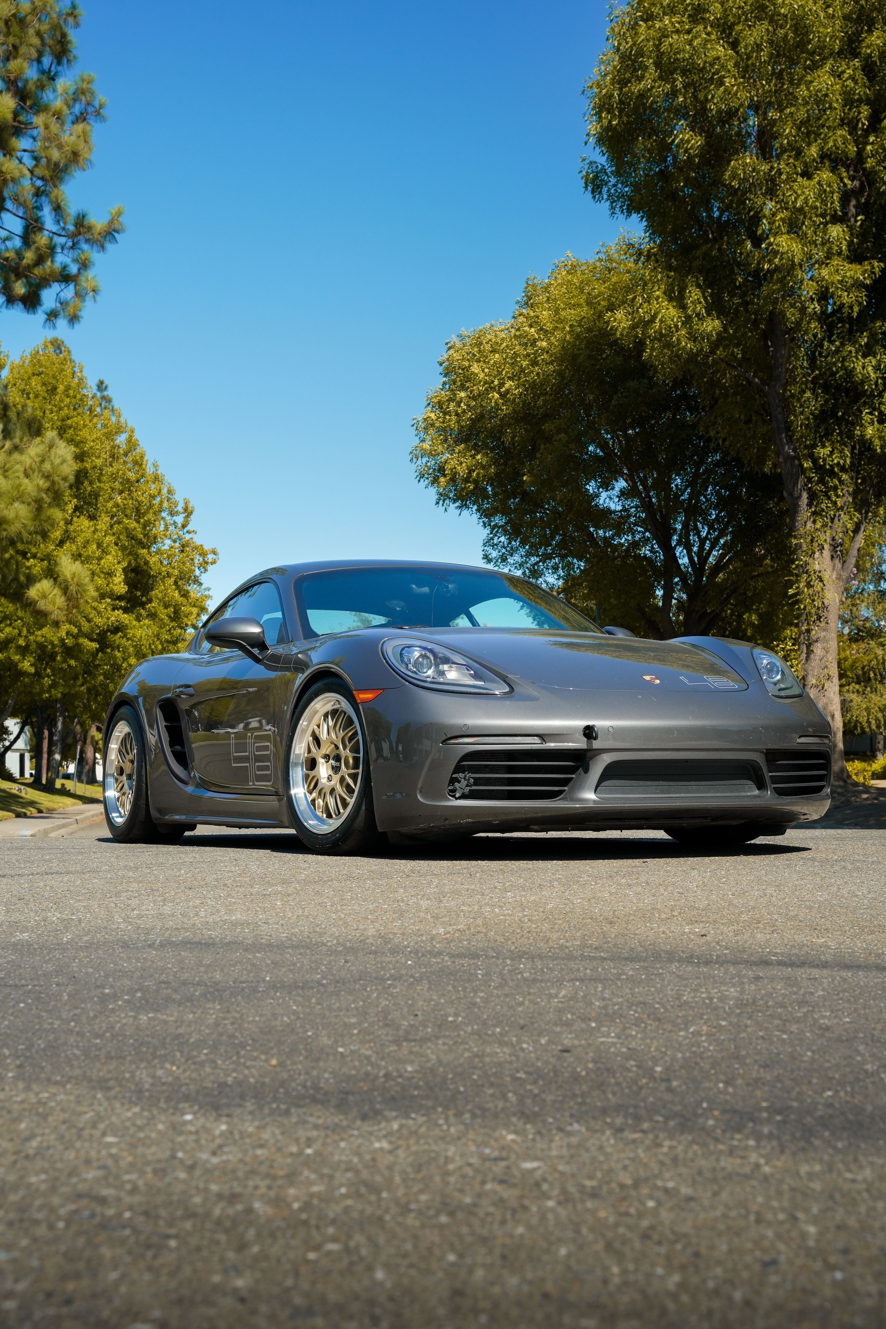 Grey Porsche 718 Cayman S with 18" ML-10RT Apex wheels in Machined Lip Gloss Motorsport Gold