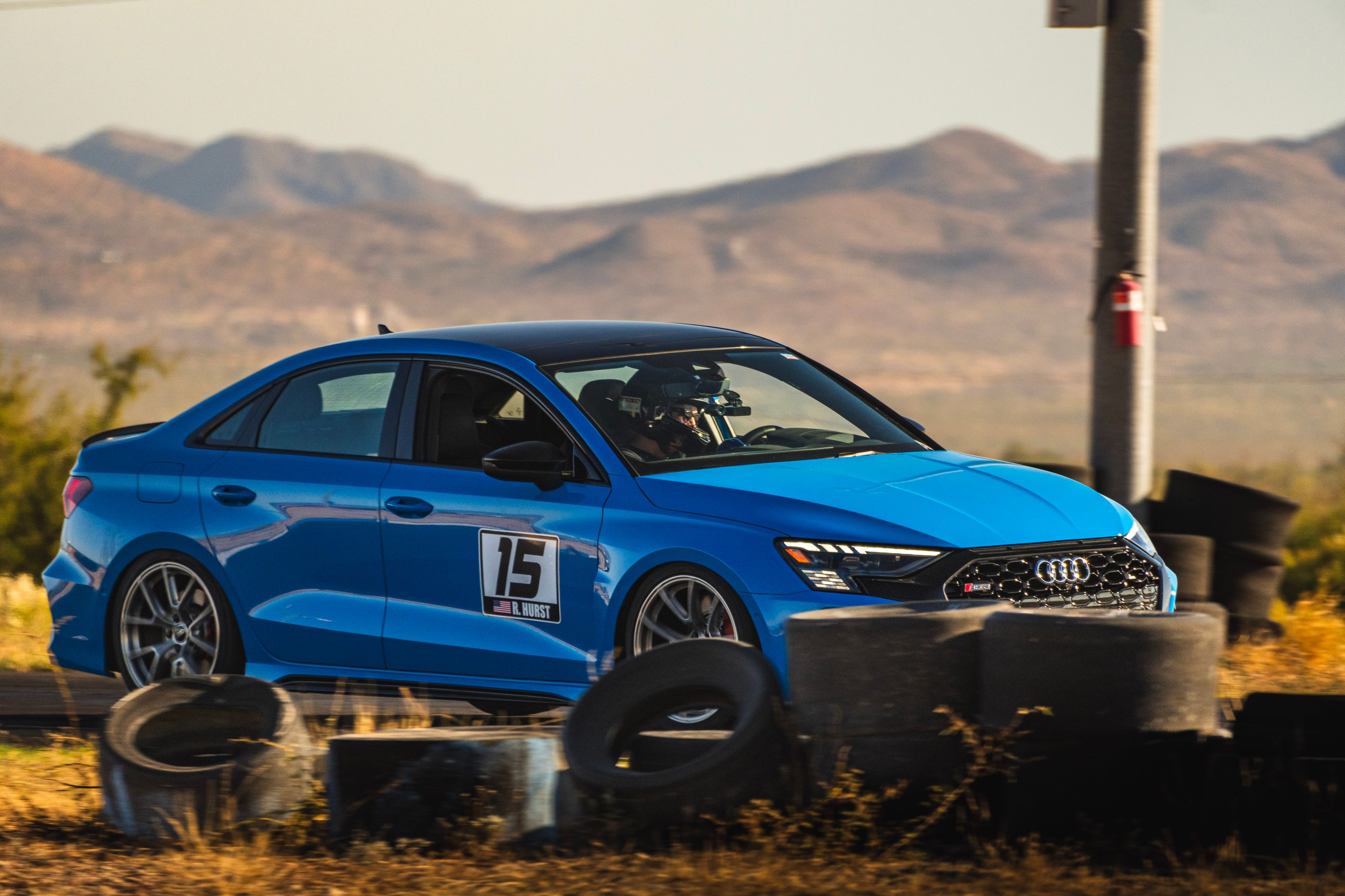 Blue Audi 8Y RS 3 with 18" VS-5RS Apex wheels in Brushed Clear