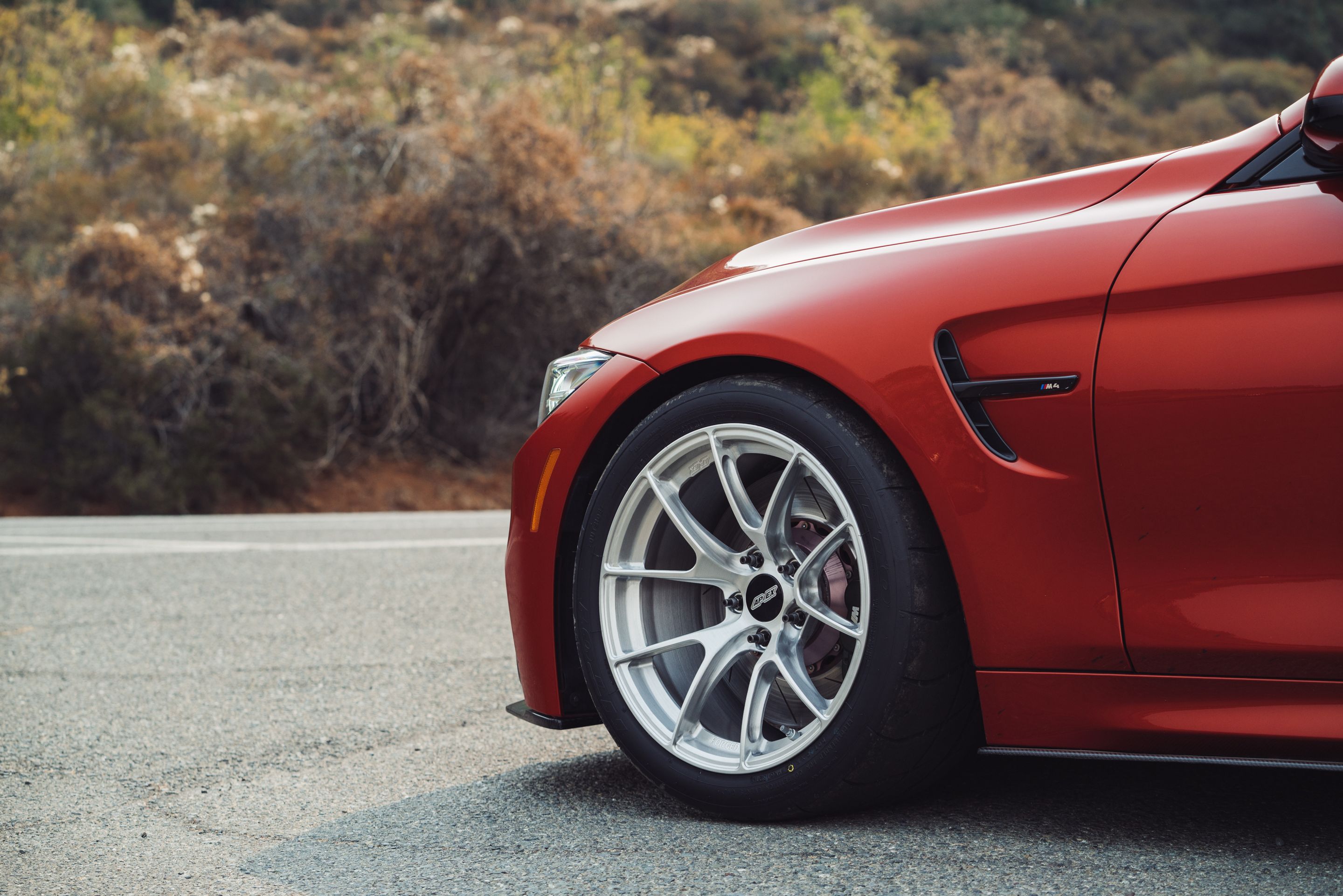 Orange BMW F82 Coupe M4 with 18" VS-5RS Apex wheels in Brushed Clear