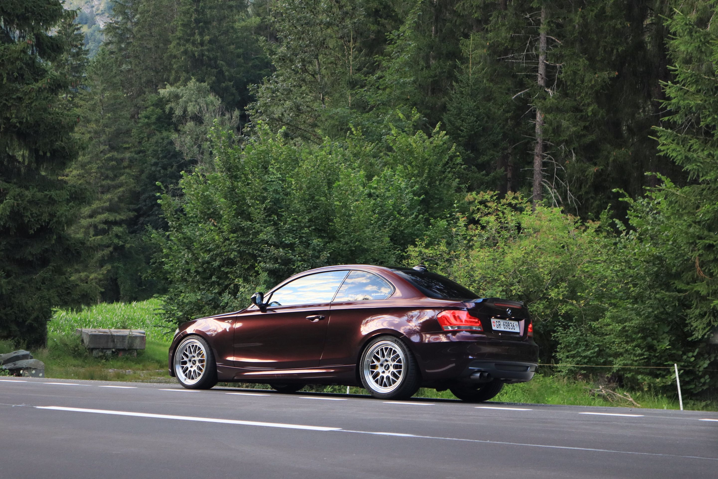 Red BMW E82 Coupe 1 Series with 18" ML-10RT Apex wheels in Machined Lip Race Silver