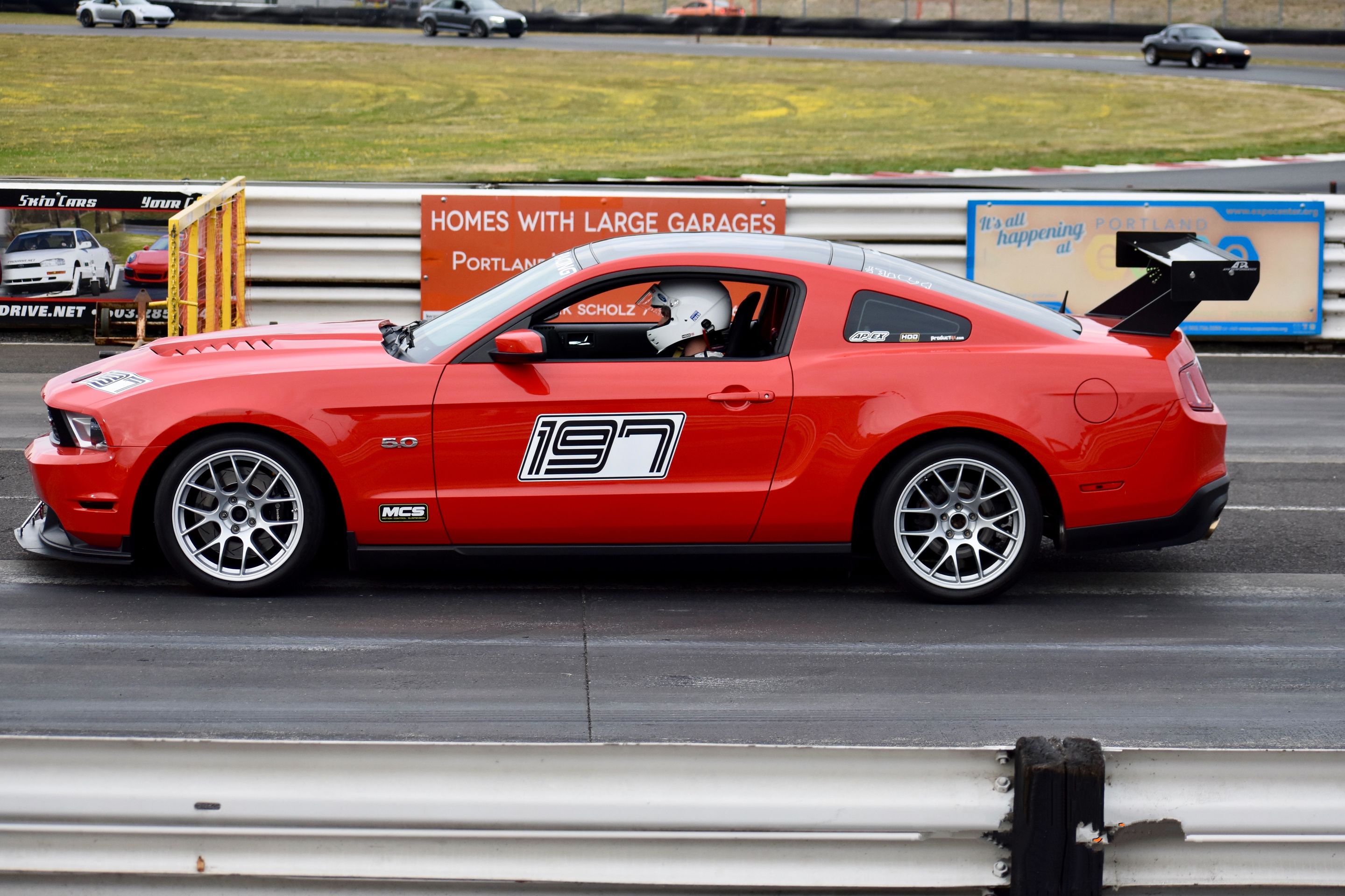 Red Ford S197 Mustang GT with 18" EC-7 Apex wheels in Race Silver