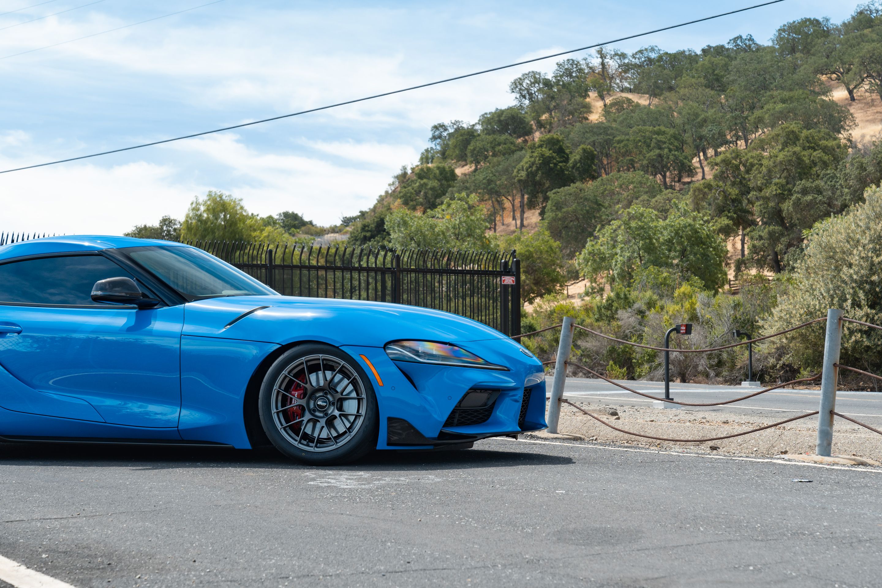 Blue Toyota GR Supra with 18" EC-7RS Apex wheels in Anthracite