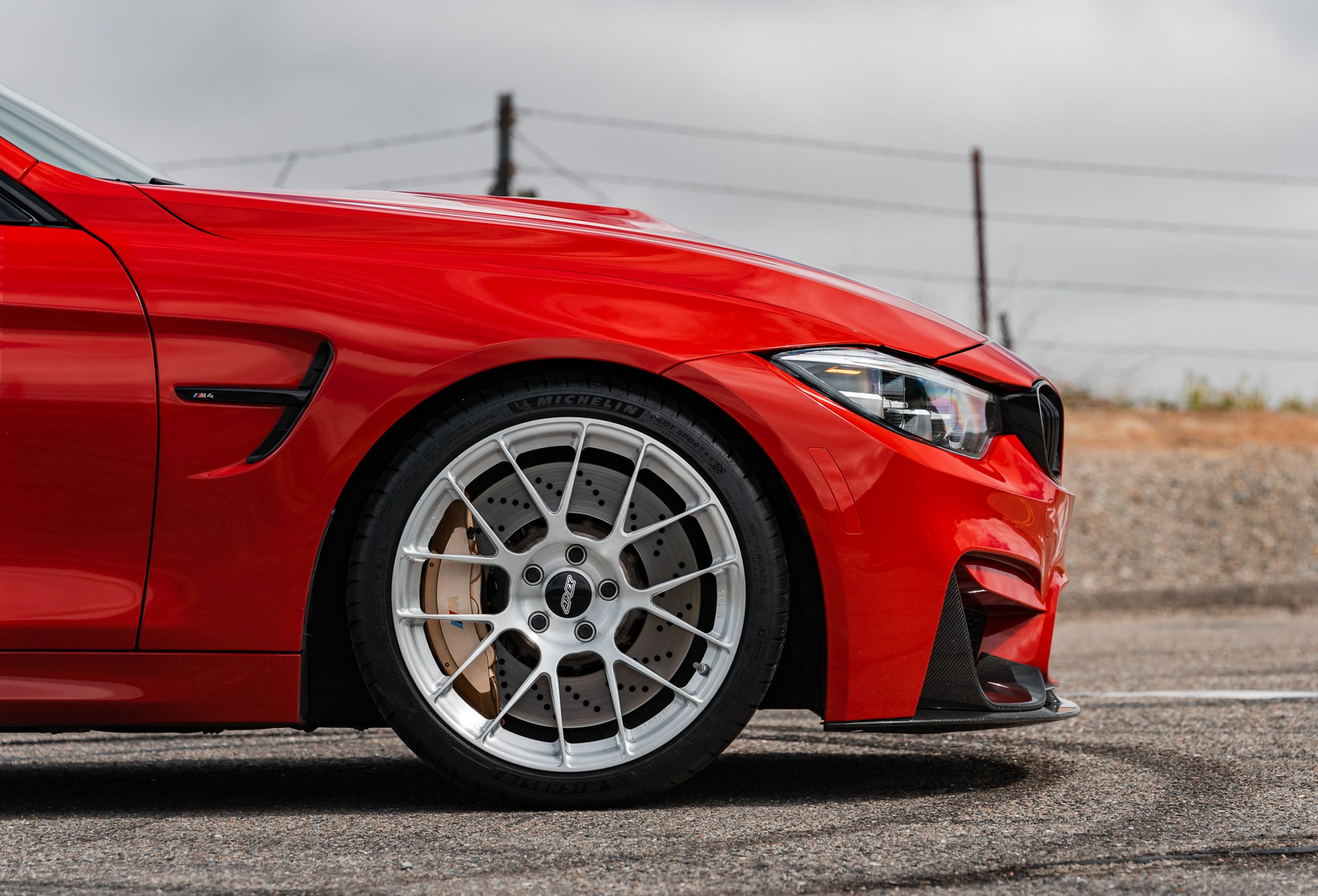 Red BMW F82 Coupe M4 with 19" EC-7RS Apex wheels in Brushed Clear