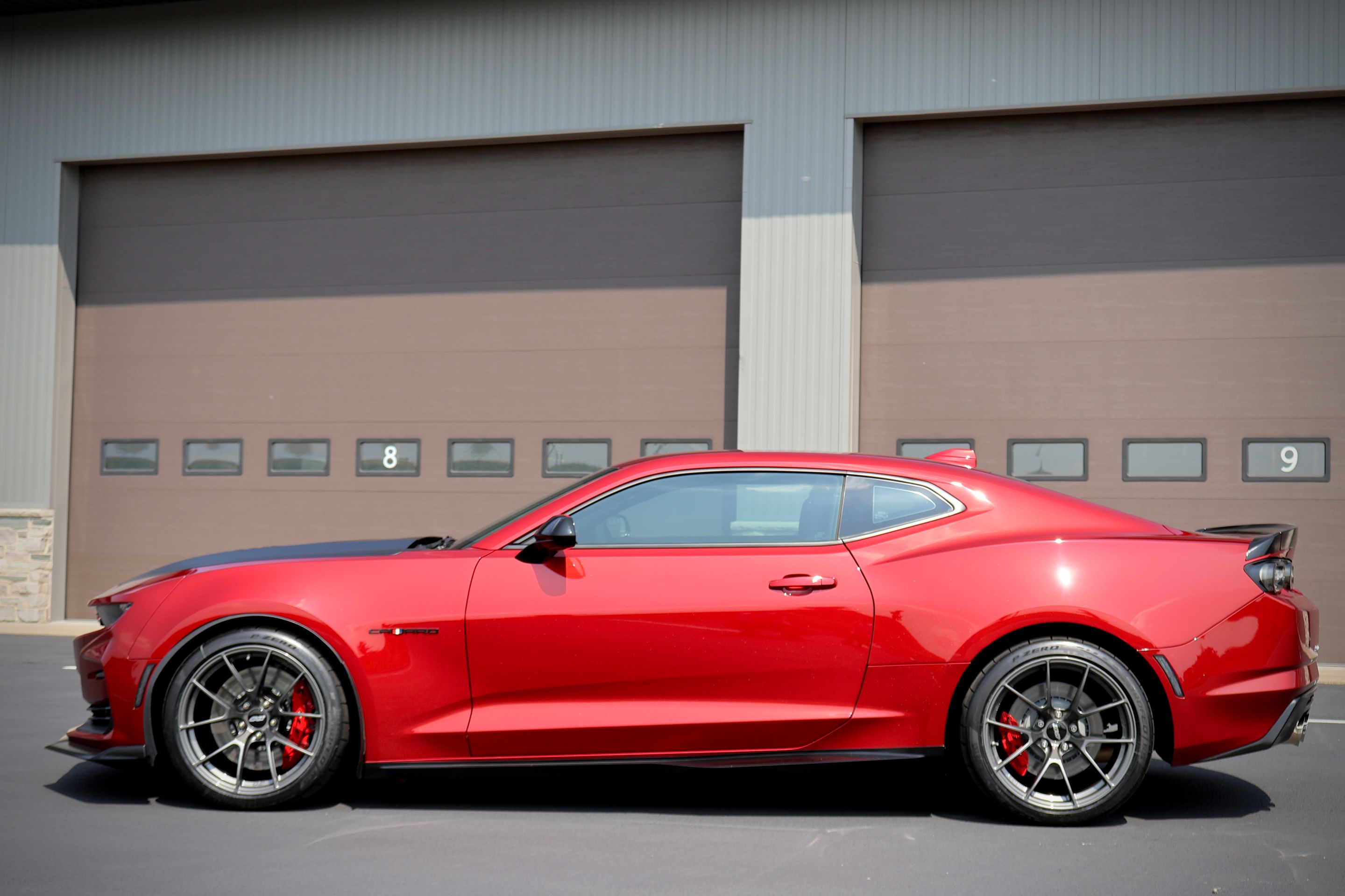 Red Chevrolet 6th Gen Camaro SS 1LE with 19" VS-5RS Apex wheels in Anthracite