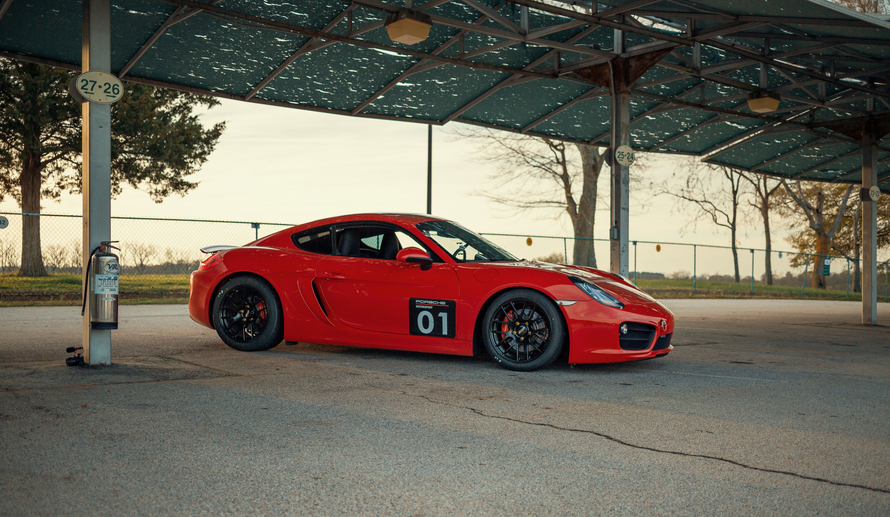 Red Porsche 981 Cayman S with 18" EC-7R Apex wheels in Satin Black