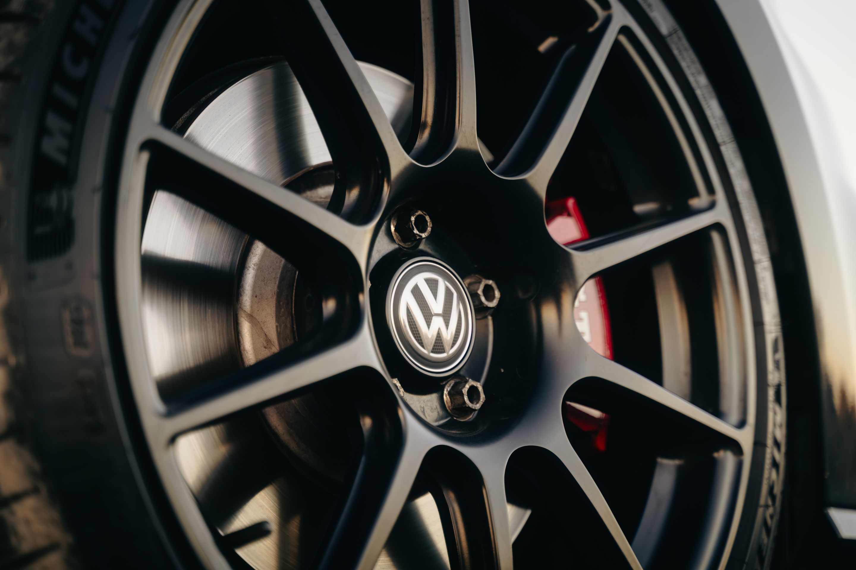 Grey VW MK7 GTI with 18" SM-10 Apex wheels in Satin Black