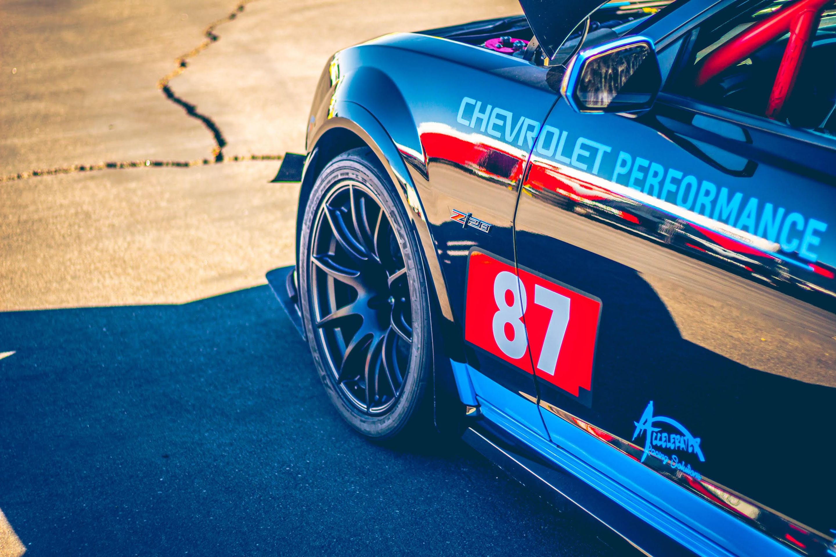 Black Chevrolet 5th Gen Camaro Z/28 with 19" SM-10 Apex wheels in Satin Black