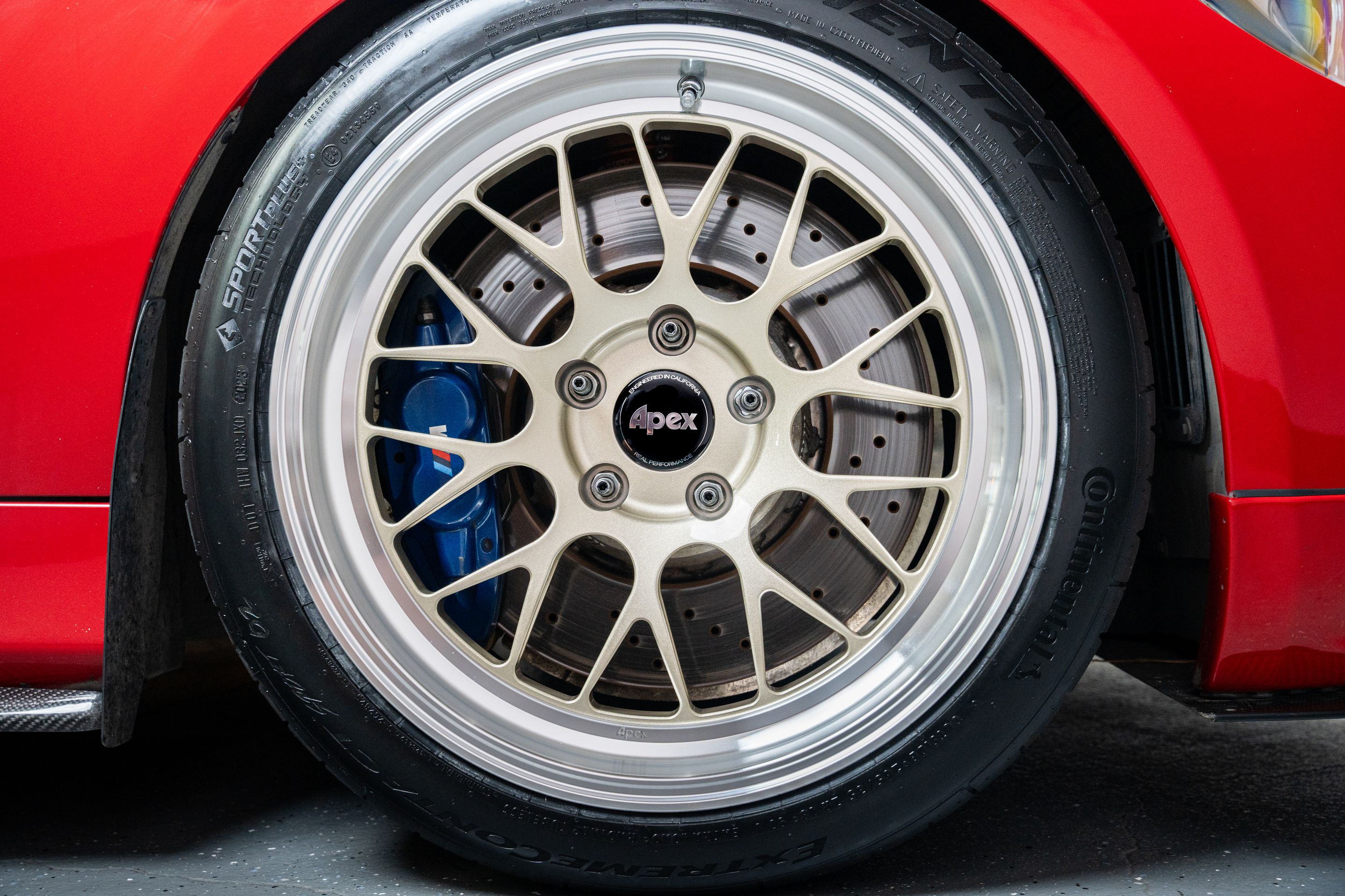 Red BMW E90 Sedan 3 Series with 18" ML-10RT Apex wheels in Machined Lip Gloss Motorsport Gold