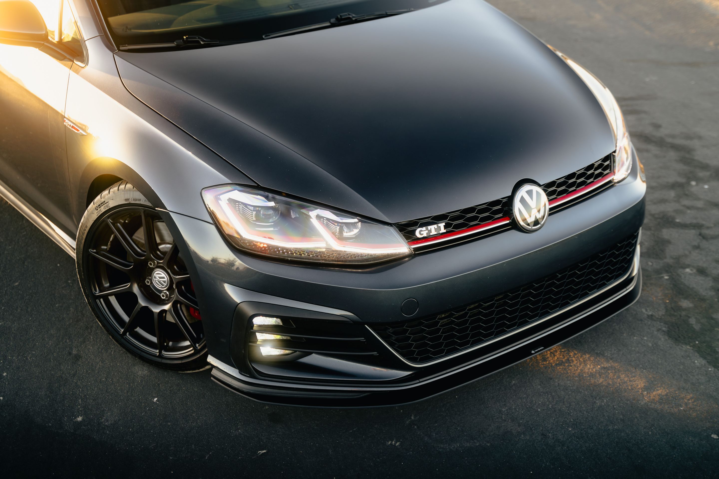 Grey VW MK7 GTI with 18" SM-10 Apex wheels in Satin Black