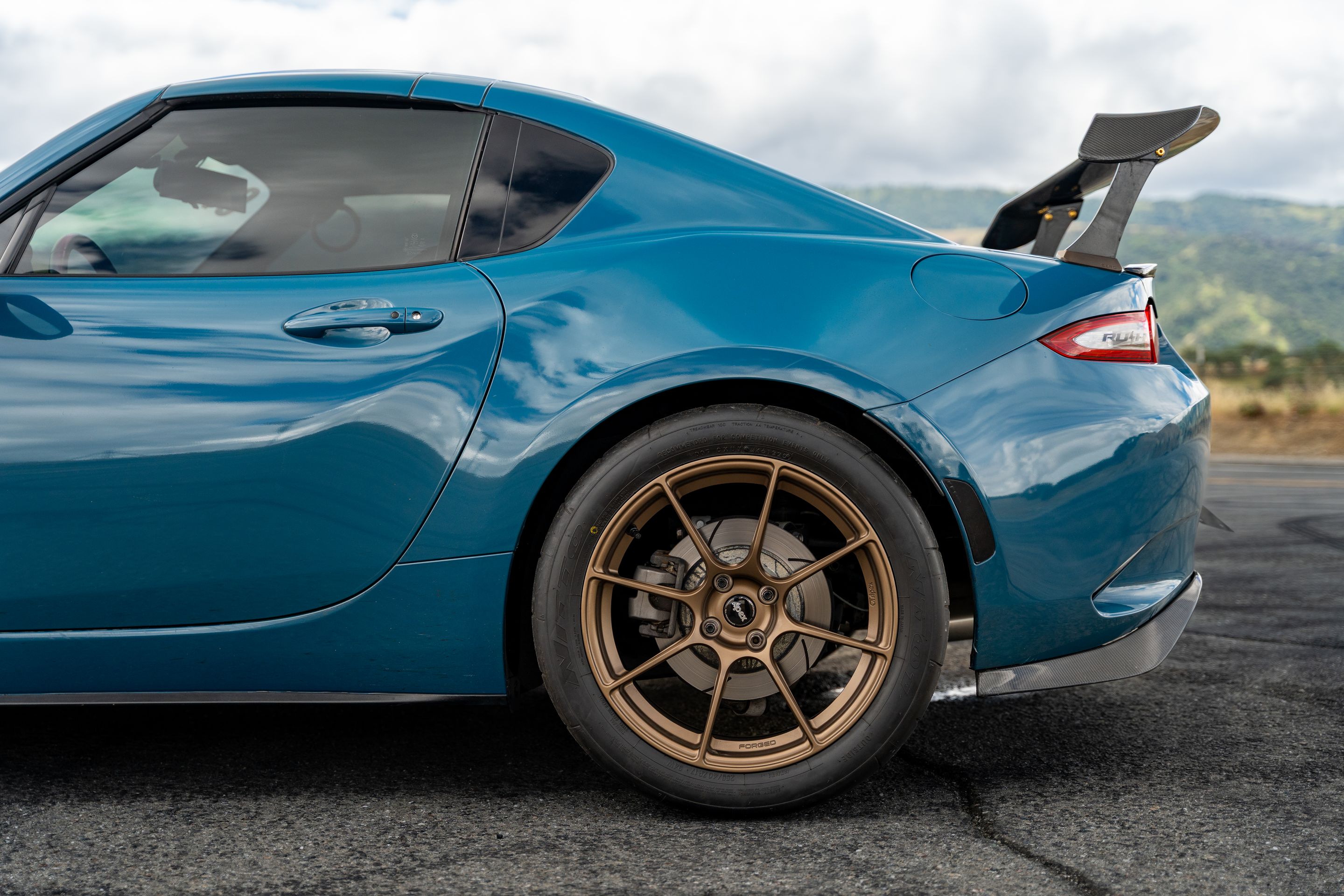 Blue Mazda ND MX-5 Miata with 17" SM-8RS Apex wheels in Satin Bronze