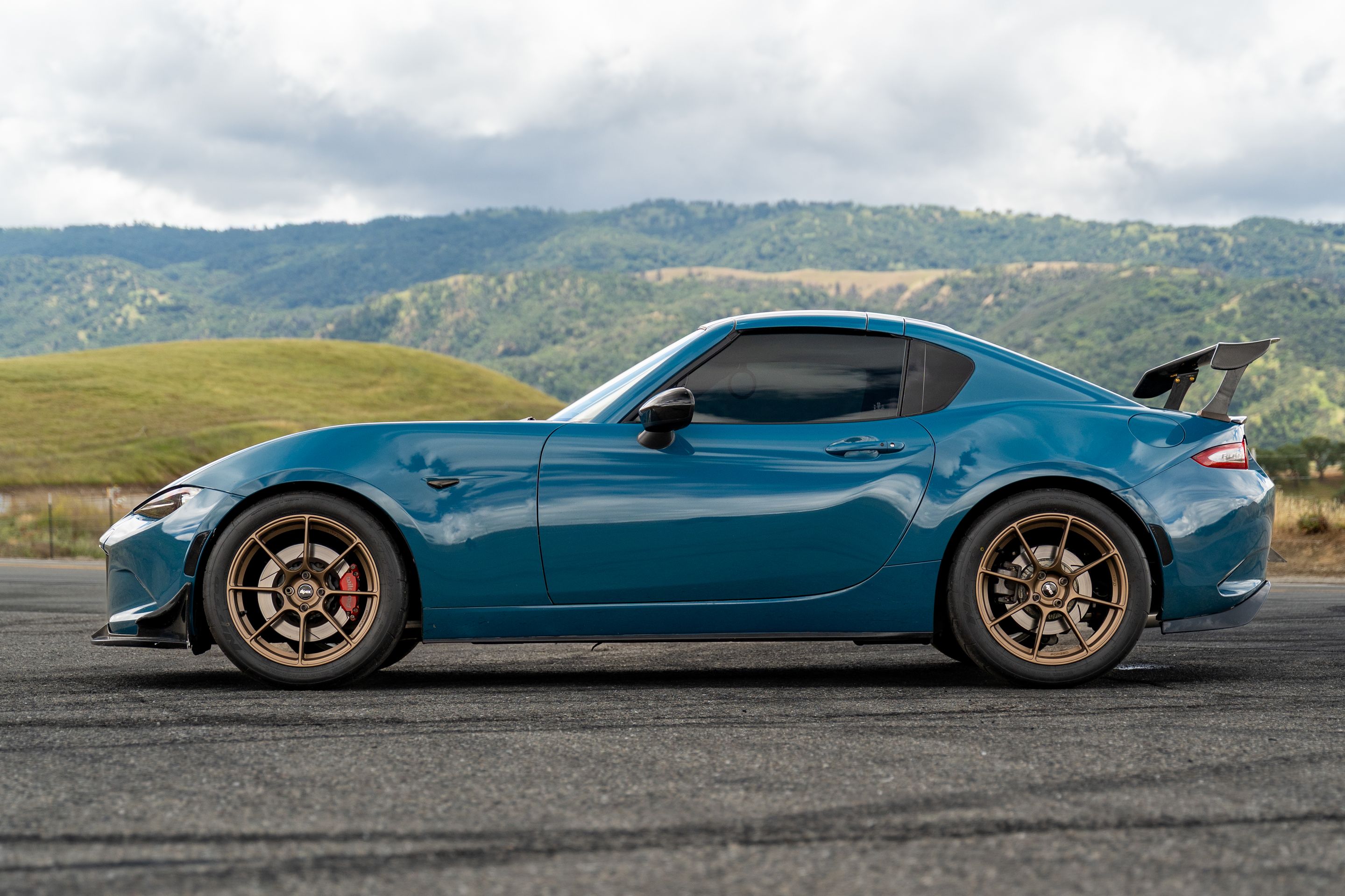 Blue Mazda ND MX-5 Miata with 17" SM-8RS Apex wheels in Satin Bronze