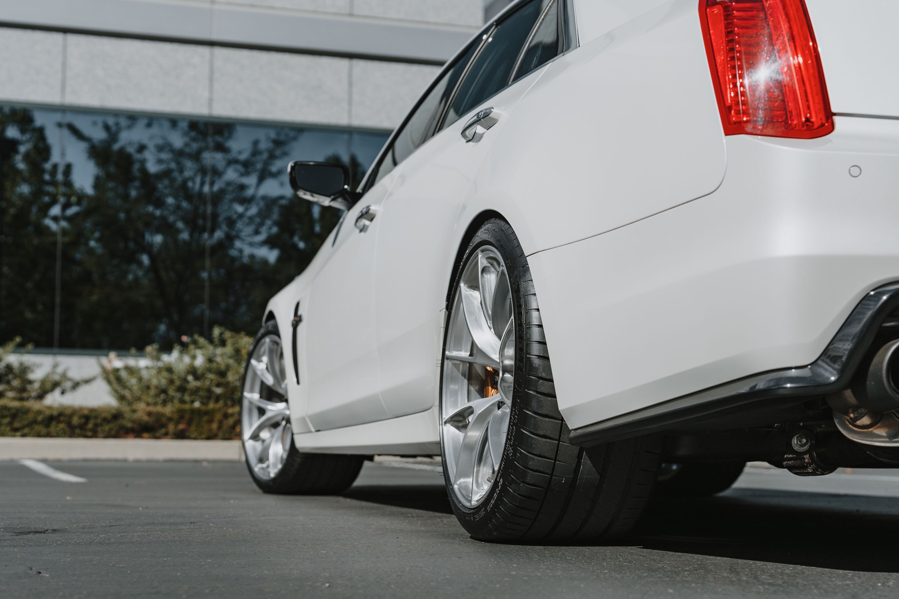 White Cadillac Gen 3 CTS-V with 20" VS-5RS Apex wheels in Brushed Clear