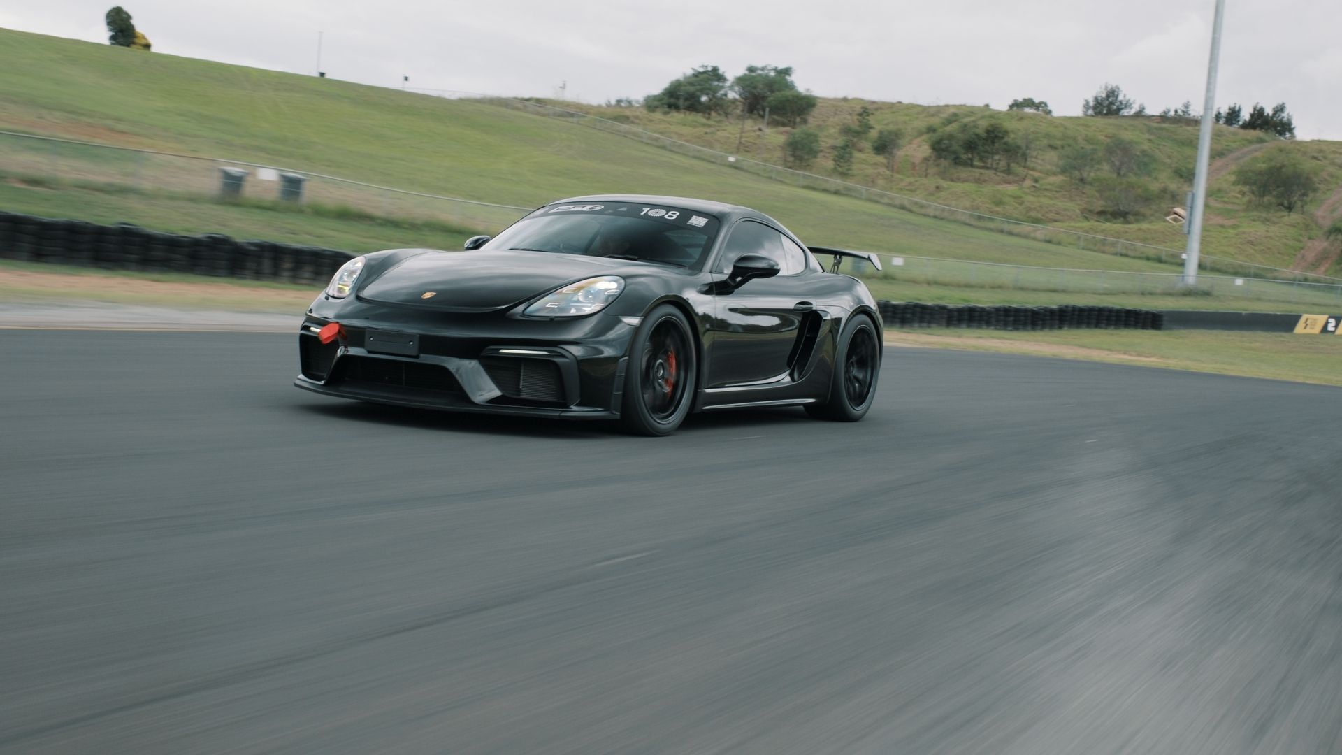 Black Porsche 718 Cayman GT4 with 19" VS-5RS Apex wheels in Satin Black