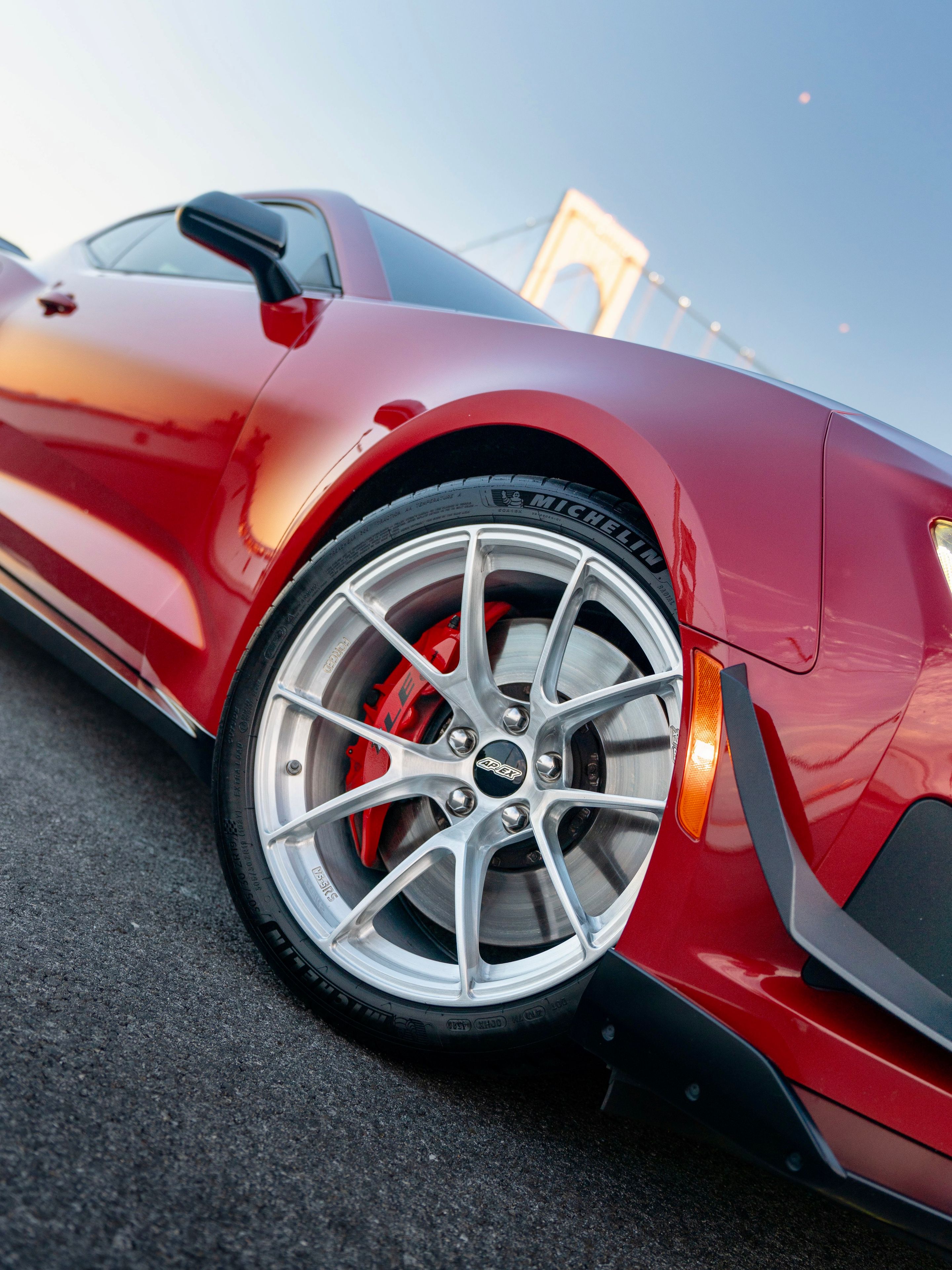 Red Chevrolet 6th Gen Camaro ZL1 1LE with 19" VS-5RS Apex wheels in Brushed Clear