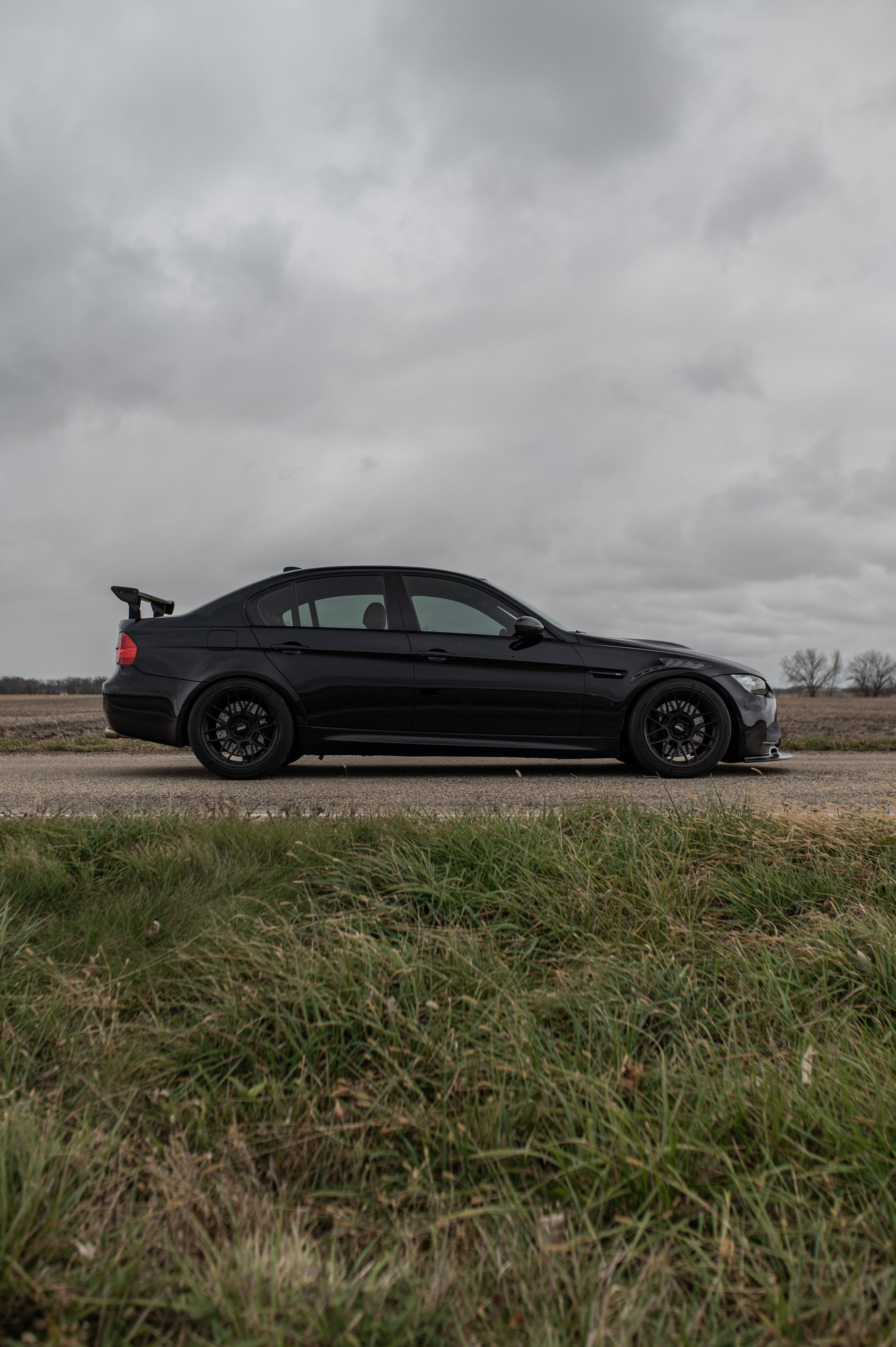 Black BMW E90 Sedan M3 with 18" ARC-8 Apex wheels in Satin Black