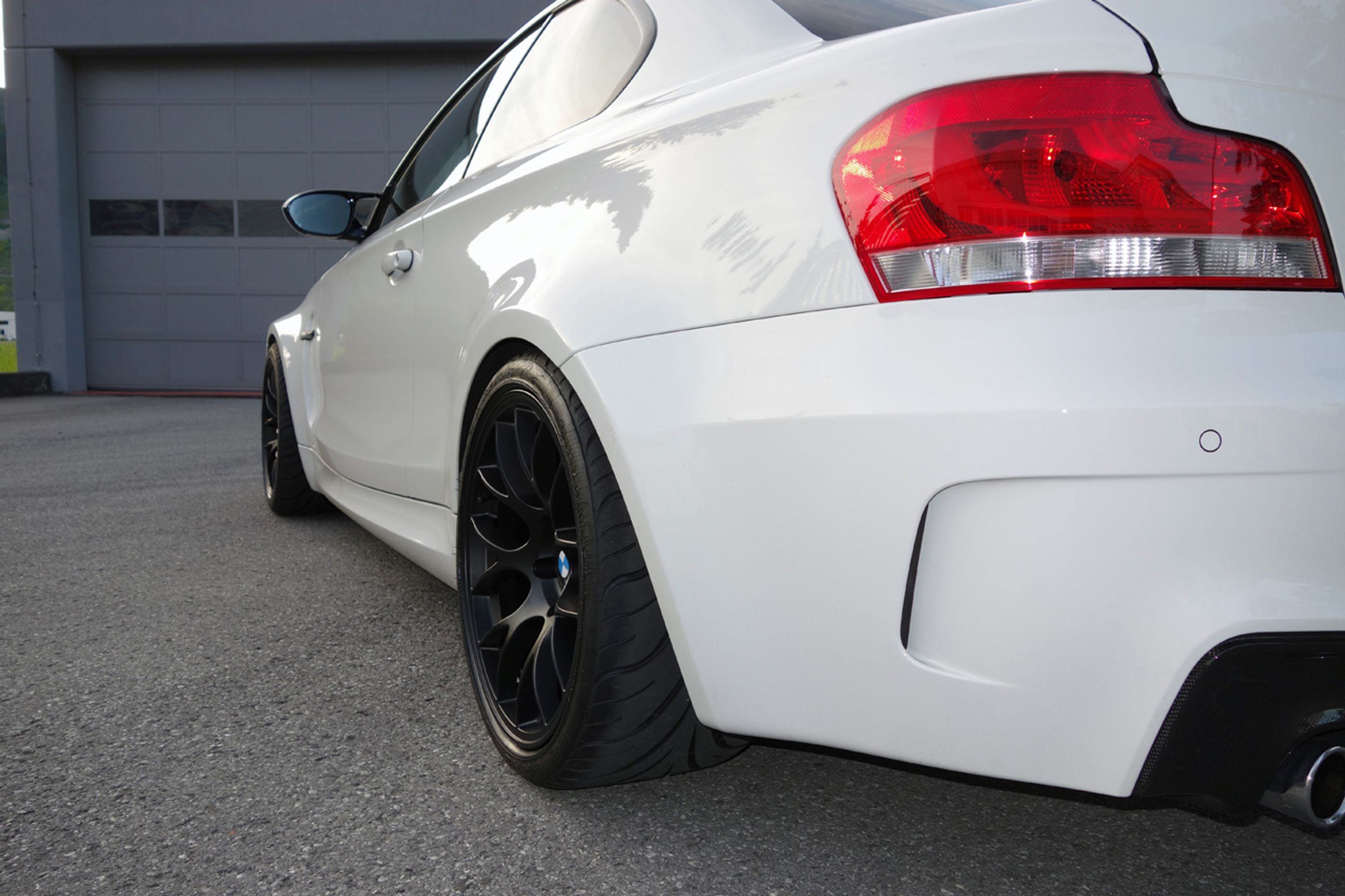 White BMW E82 1M with 18" EC-7 Apex wheels in Satin Black
