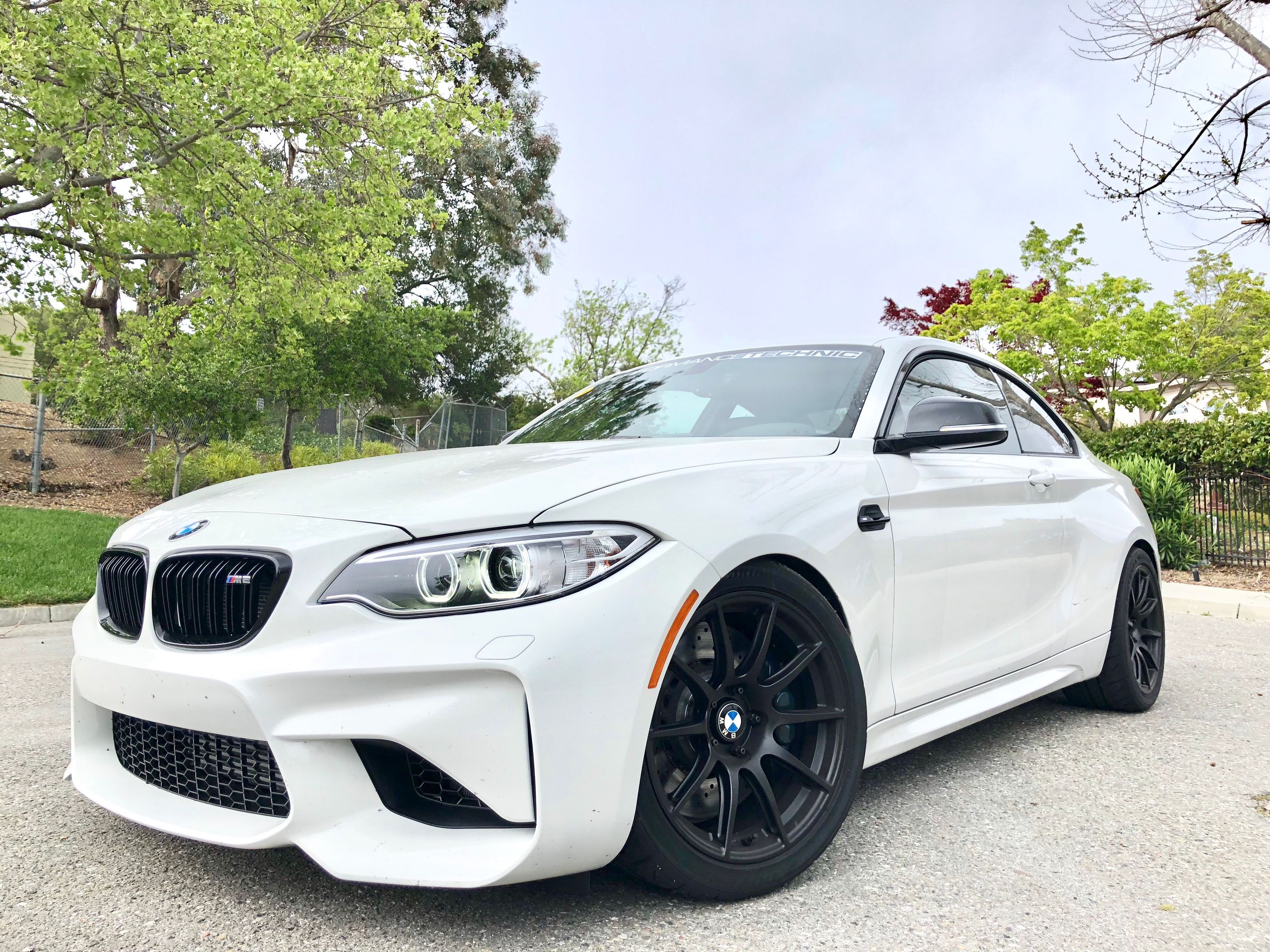 White BMW F87 M2 with 18" SM-10 Apex wheels in Satin Black