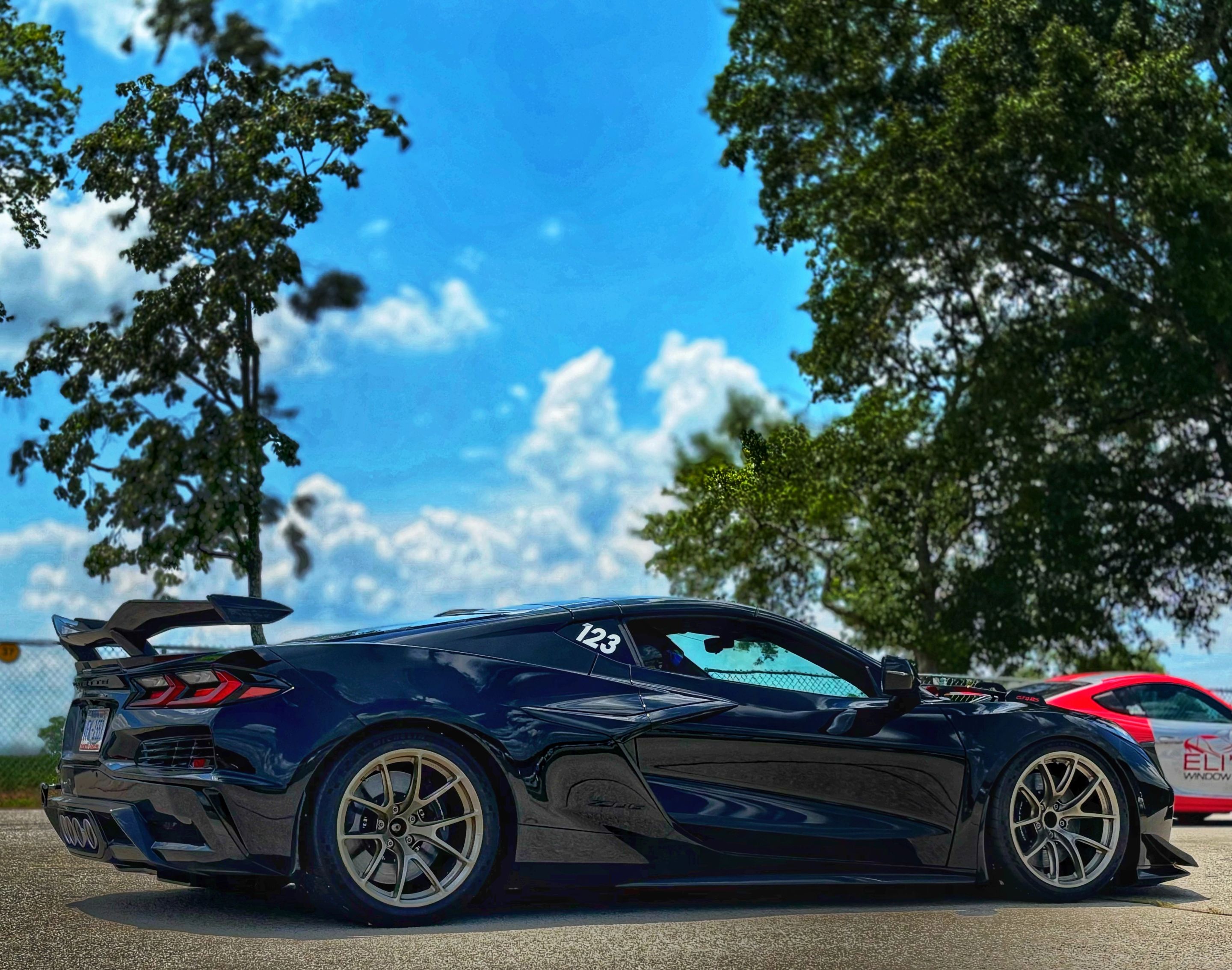 Black Chevrolet C8 Corvette Z06 with 19" VS-5RS Apex wheels in Motorsport Gold