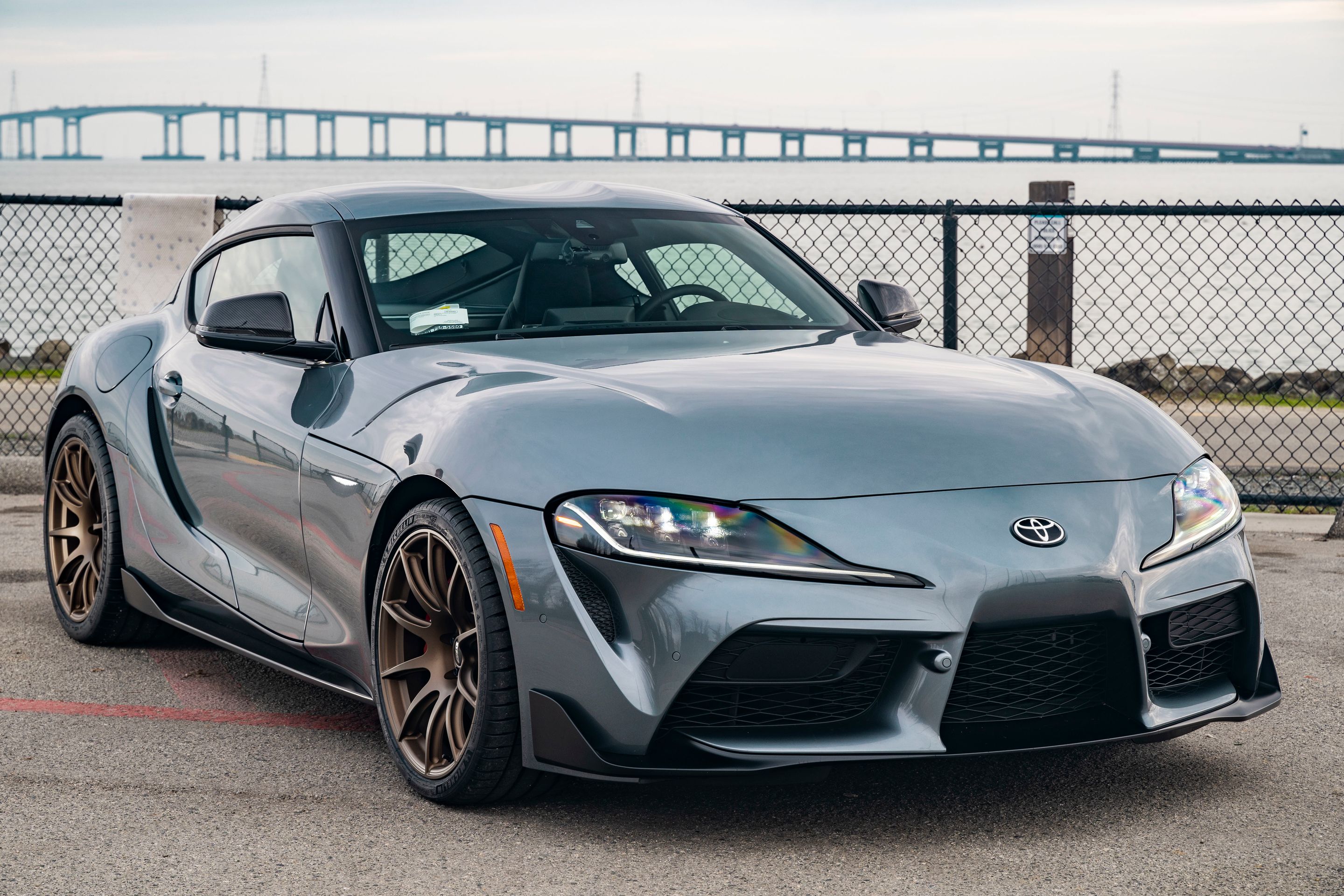 Grey Toyota GR Supra with 19" SM-10 Apex wheels in Satin Bronze