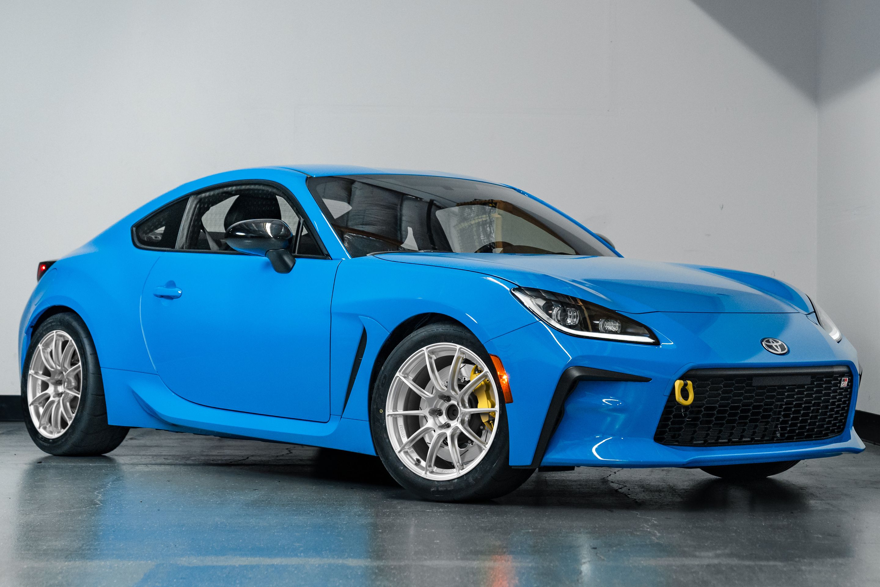 Blue Toyota GR86 with 17" SM-10RS Apex wheels in Brushed Clear