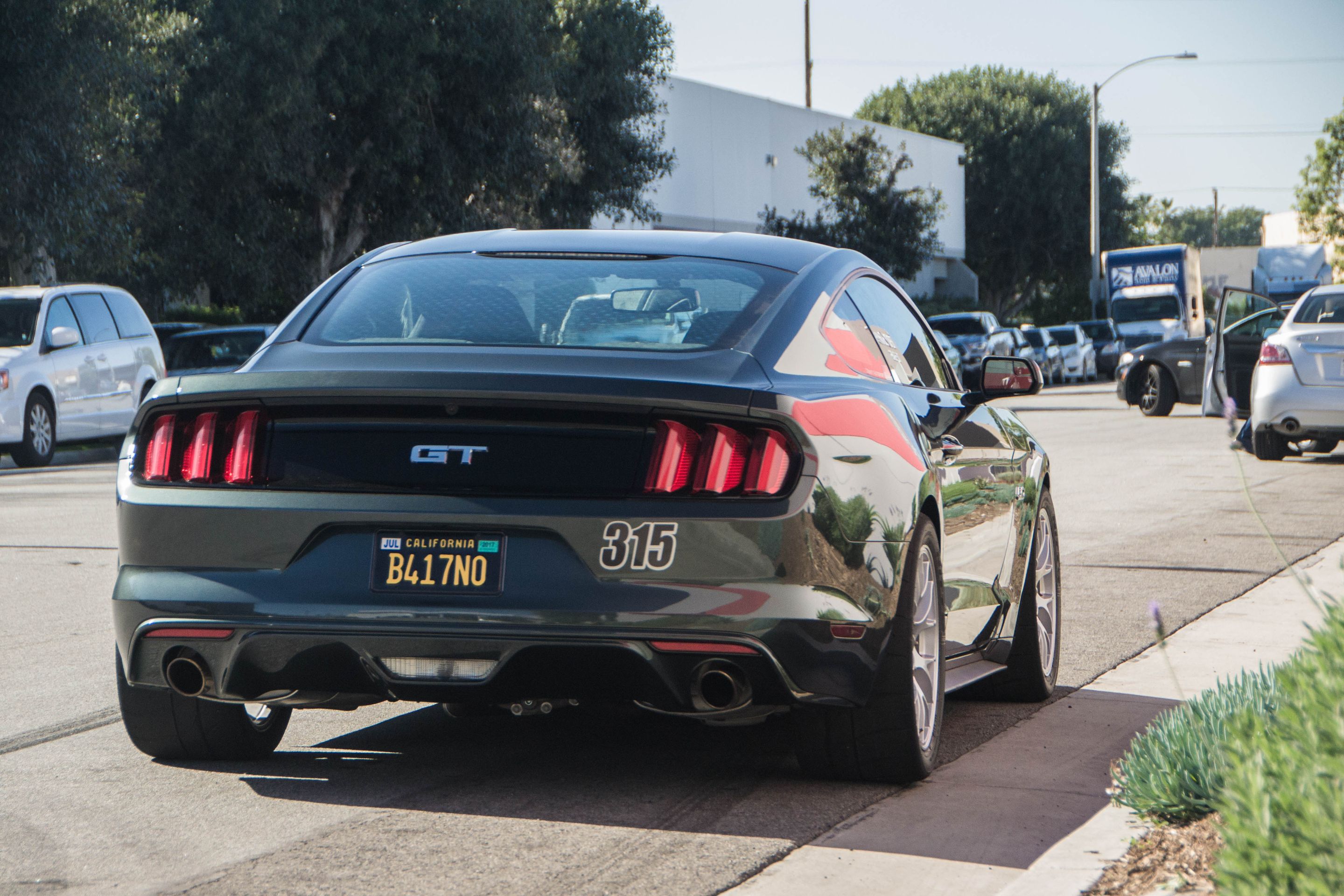 Green Ford S550 Mustang GT with 18" EC-7 Apex wheels in Race Silver