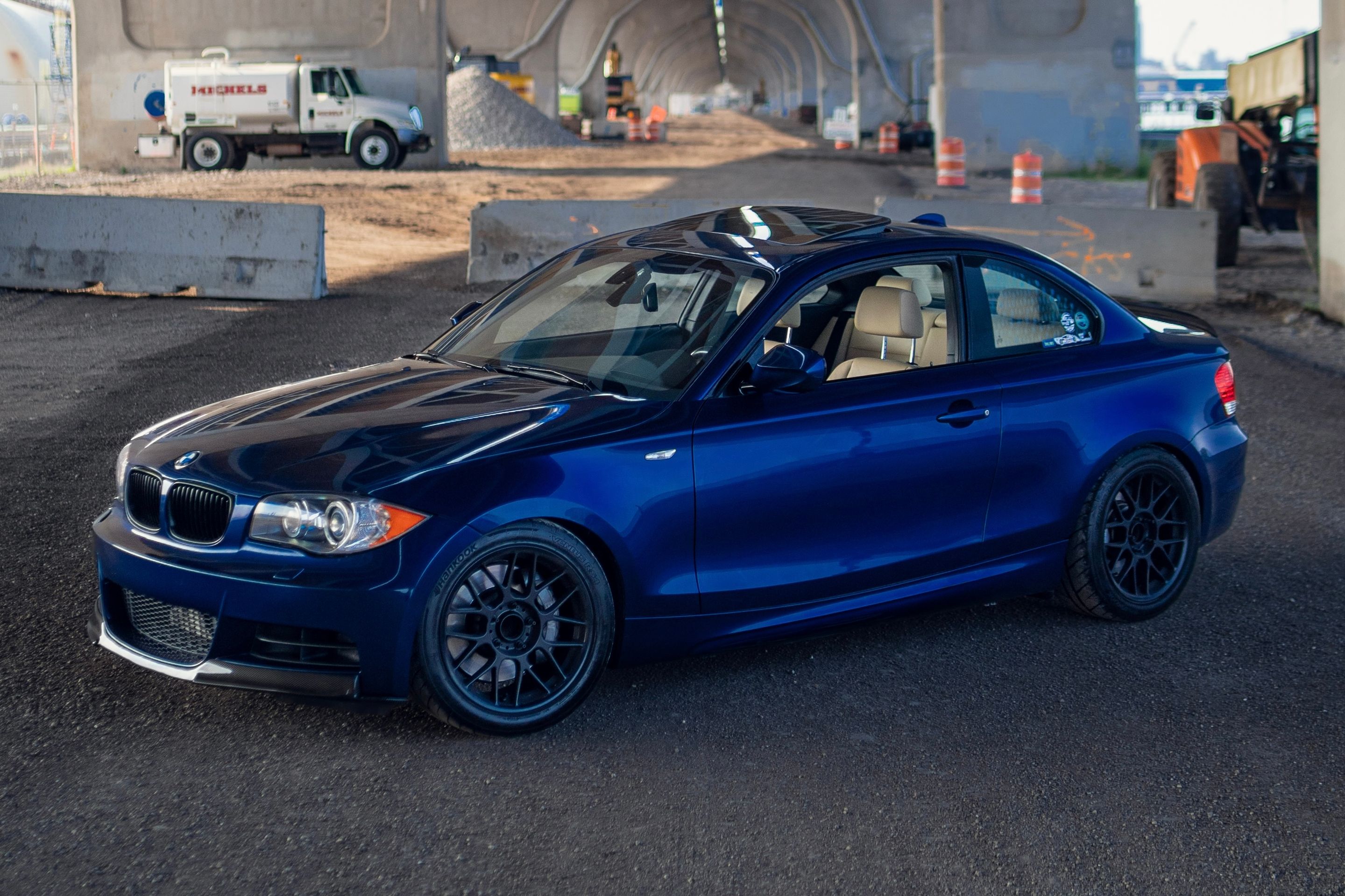 Blue BMW E82 Coupe 1 Series with 17" ARC-8 Apex wheels in Satin Black